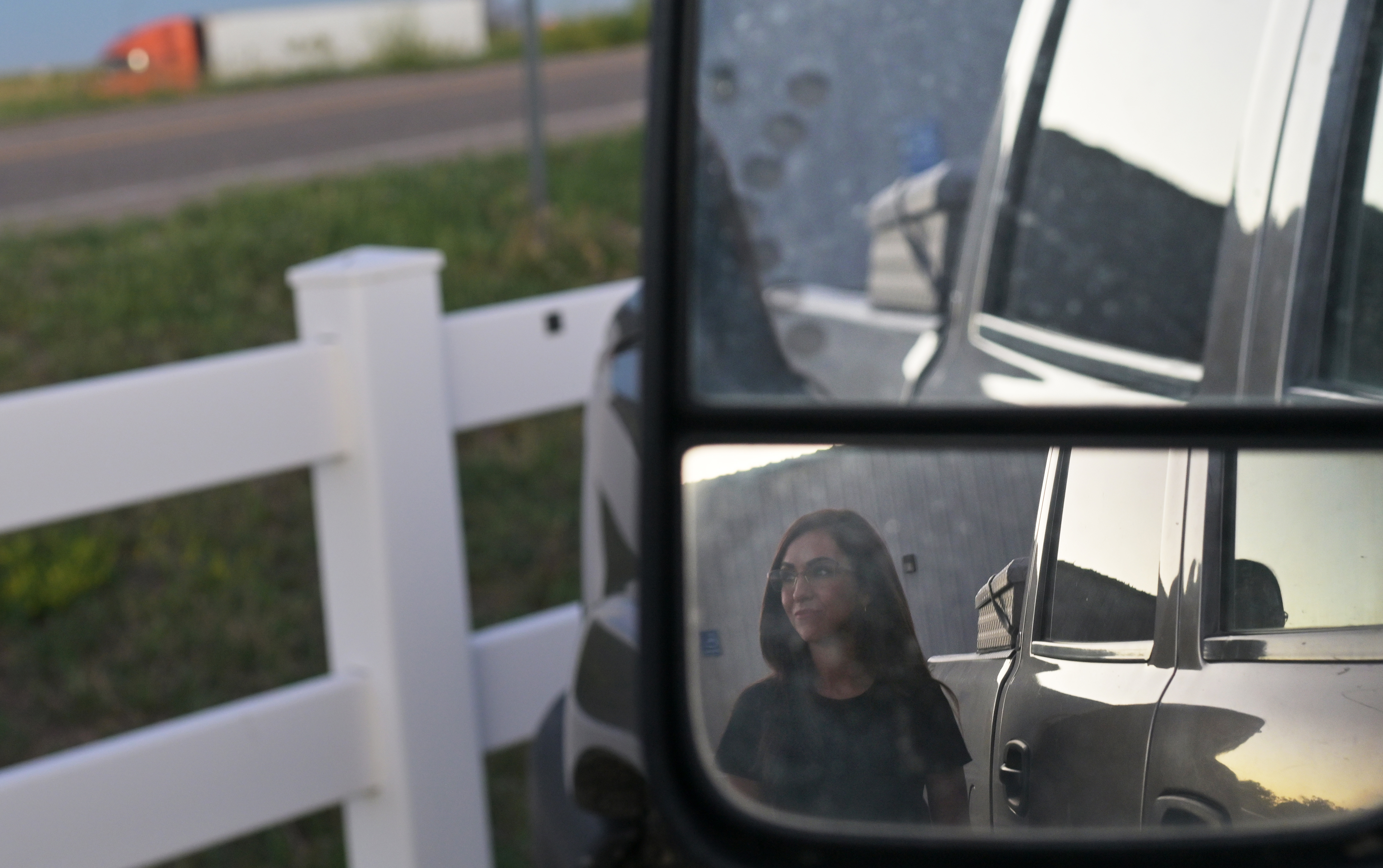 U.S. Rep. Lauren Boebert is seen in a truck mirror as she walks outside after a debate put on by the Colorado Farm Bureau for Republican candidates running in the 4th Congressional District primary race at the Stratton Activity Center in Stratton, Colorado, on June 6, 2024. (Photo by RJ Sangosti/The Denver Post)