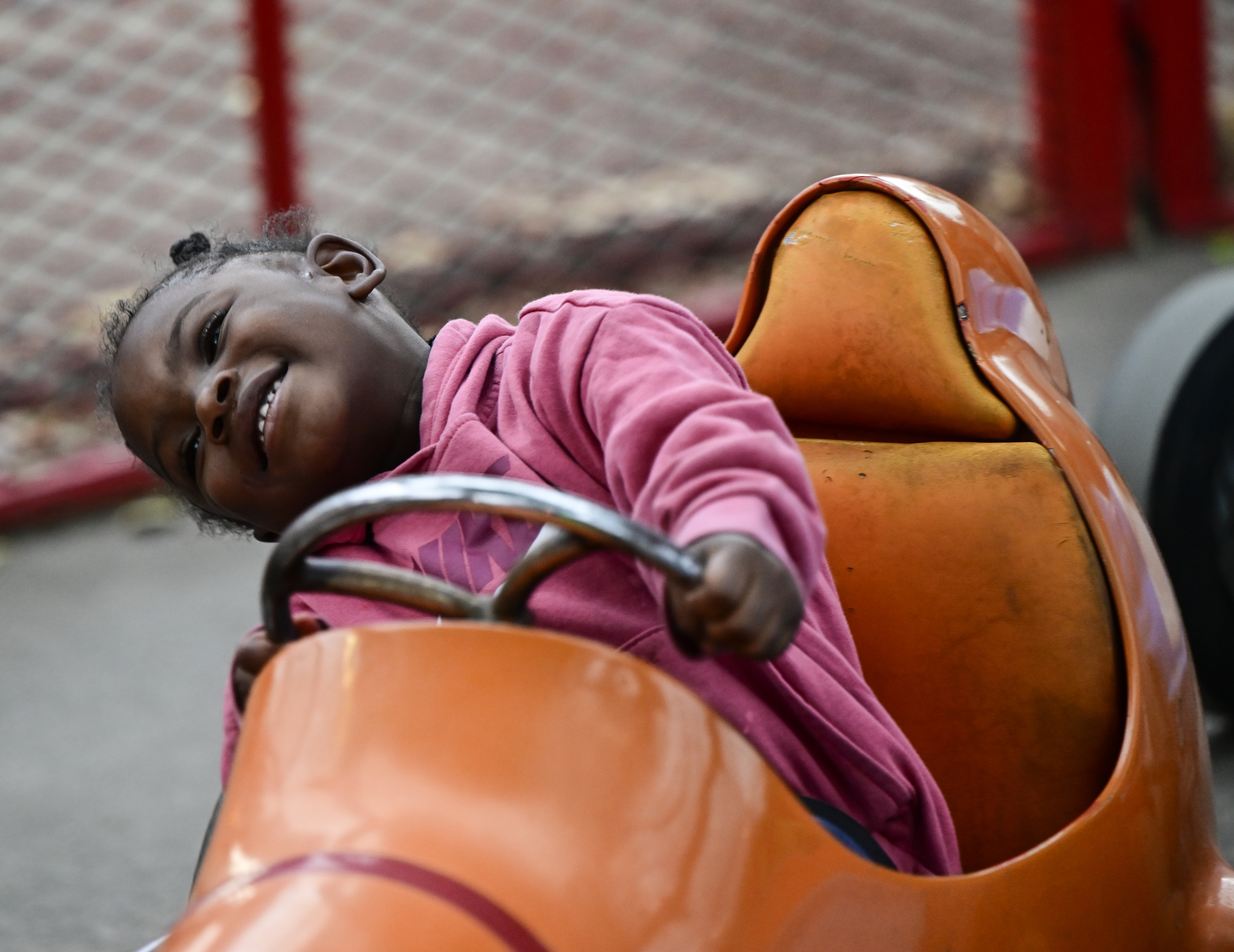 Torilynn Collins, 4, enjoys the Midge-O-Racer ride at the Lakeside Amusement Park in Lakeside, Colorado Thursday, June 27, 2024. (Photo by Andy Cross/The Denver Post)