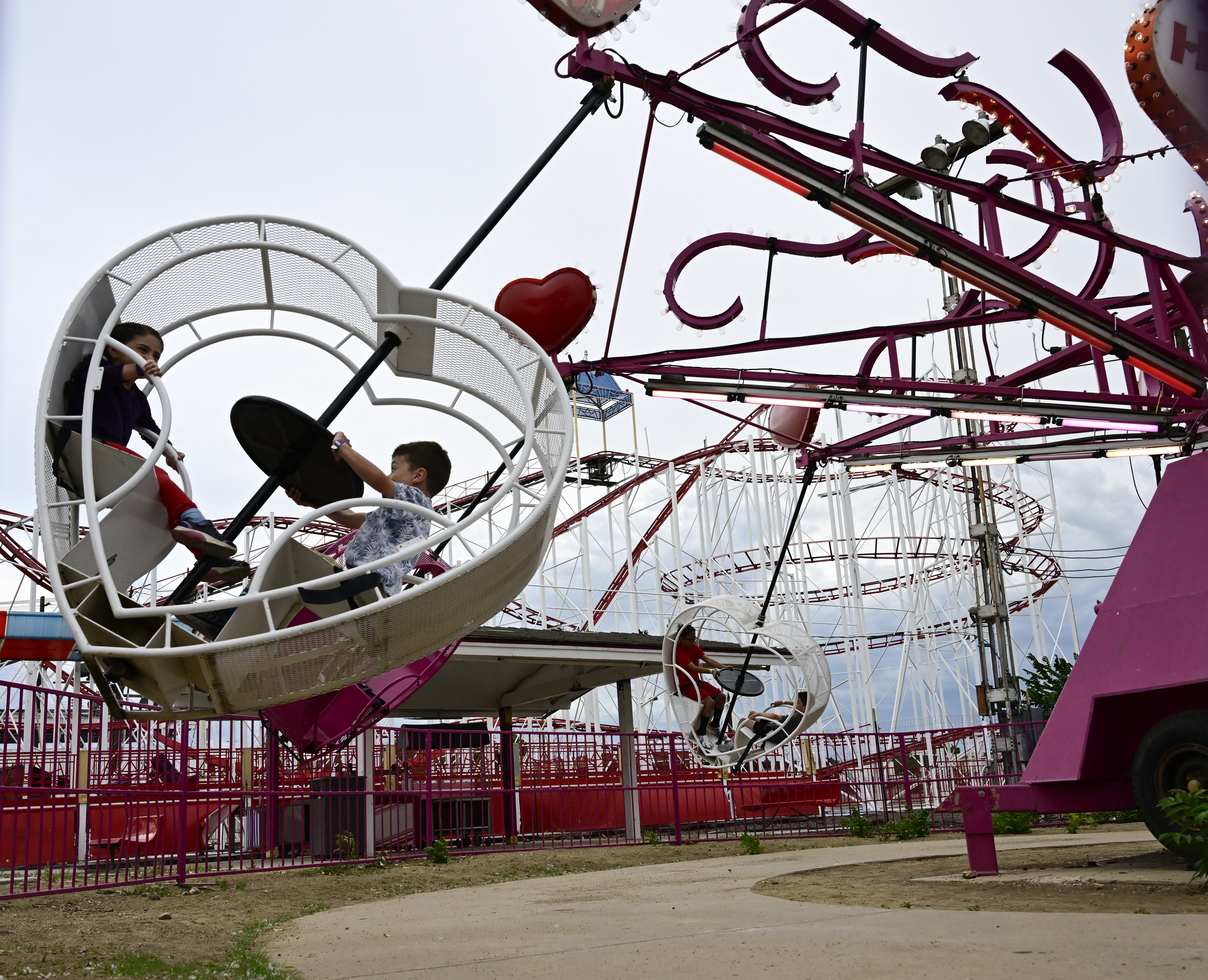 Young thrill seekers enjoys the Heart Flip ride at the Lakeside Amusement Park in Lakeside, Colorado Thursday, June 27, 2024. (Photo by Andy Cross/The Denver Post)