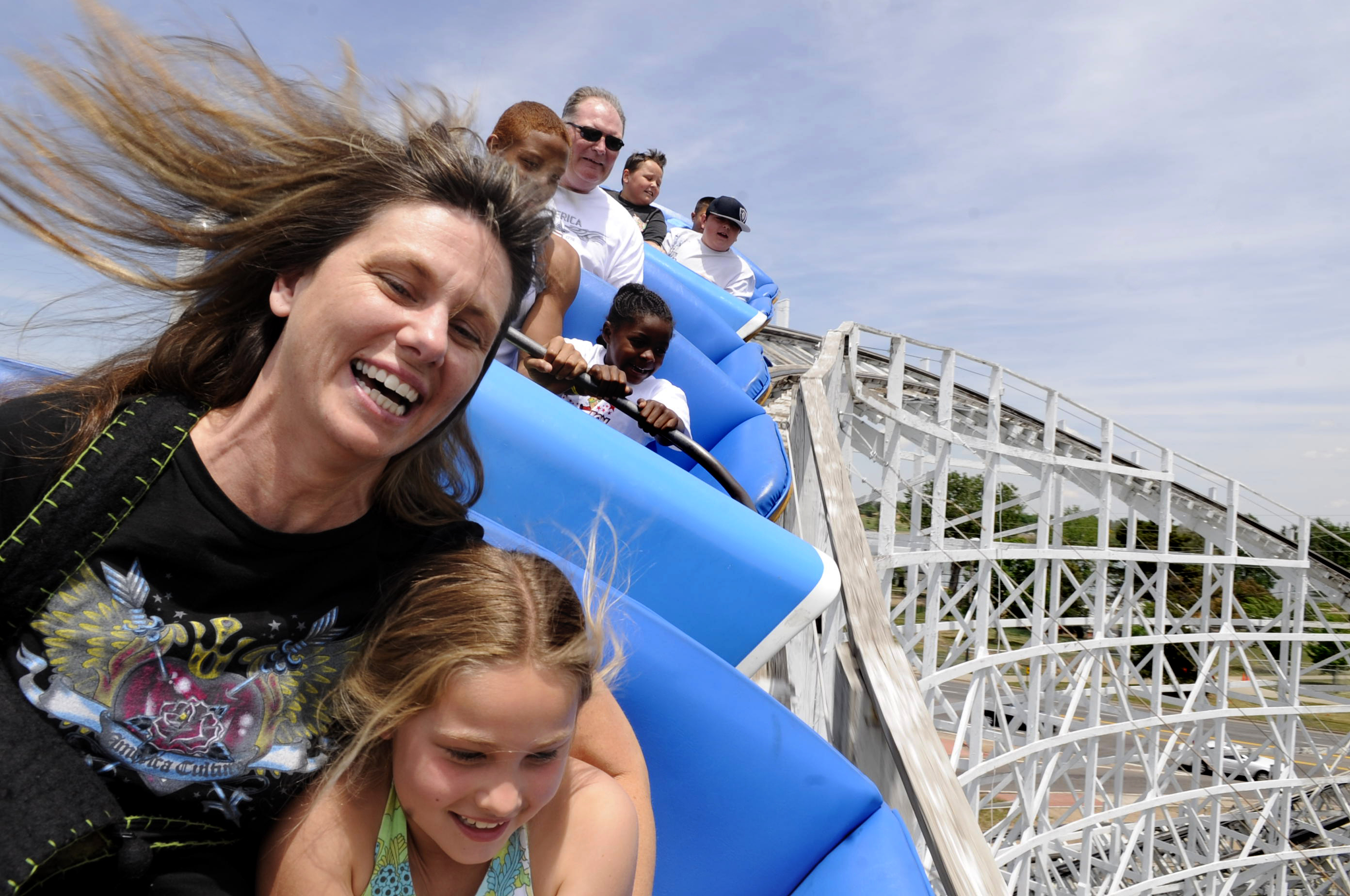 Morgan Hutson, 8, gets close to her mother Amanda Hutson on the Cyclone Coaster at Lakeside Amusement Park in Lakeside, Colorado, on June 1, 2008. (Photo by Helen H. Richardson/The Denver Post)