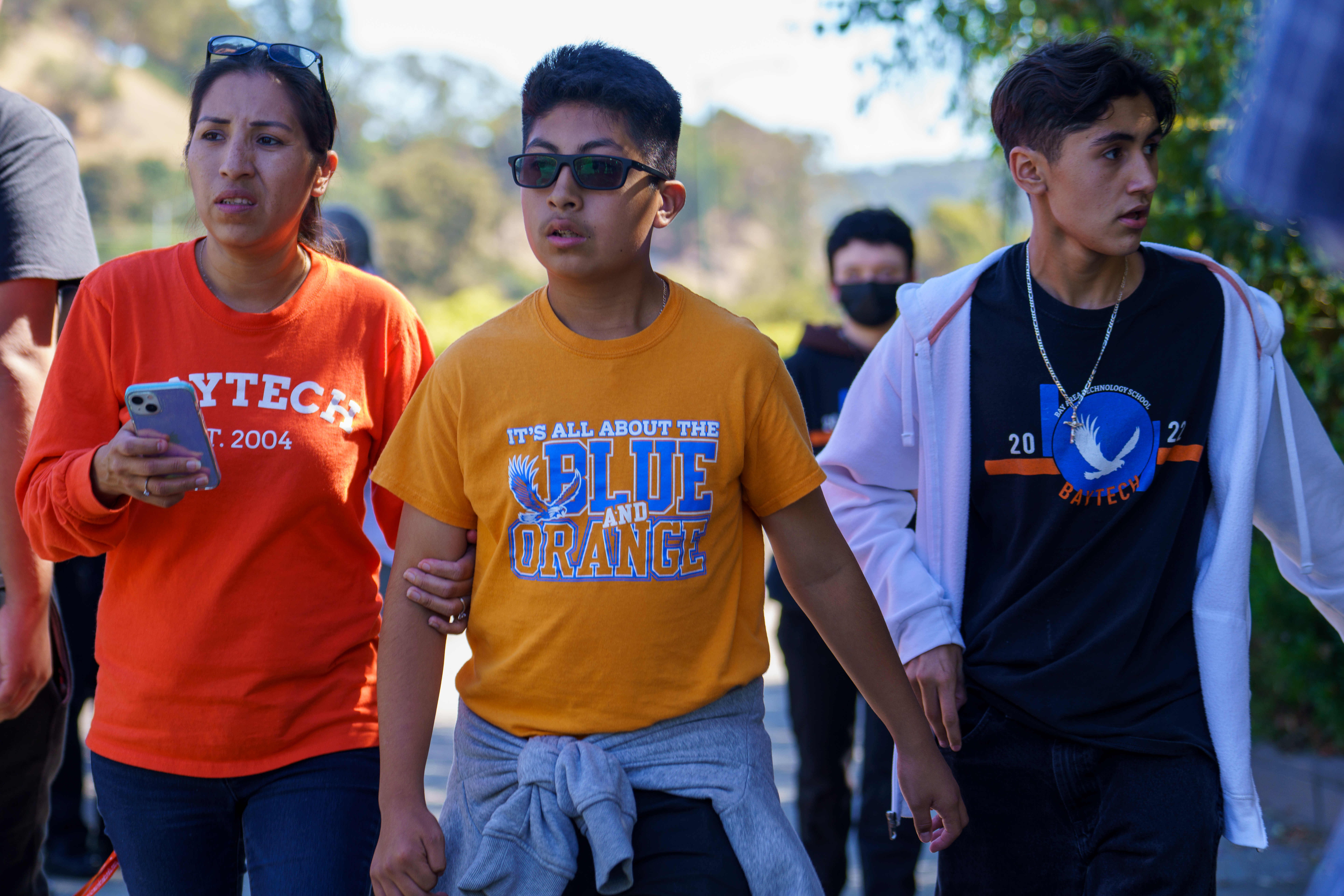 OAKLAND, CALIFORNIA - SEPTEMBER 28: Bay Area Technology School students, faculty and staff walk off campus following a multiple-injury shooting in Oakland, Calif., on Wednesday, Sept. 28, 2022. (Dylan Bouscher/Bay Area News Group)
