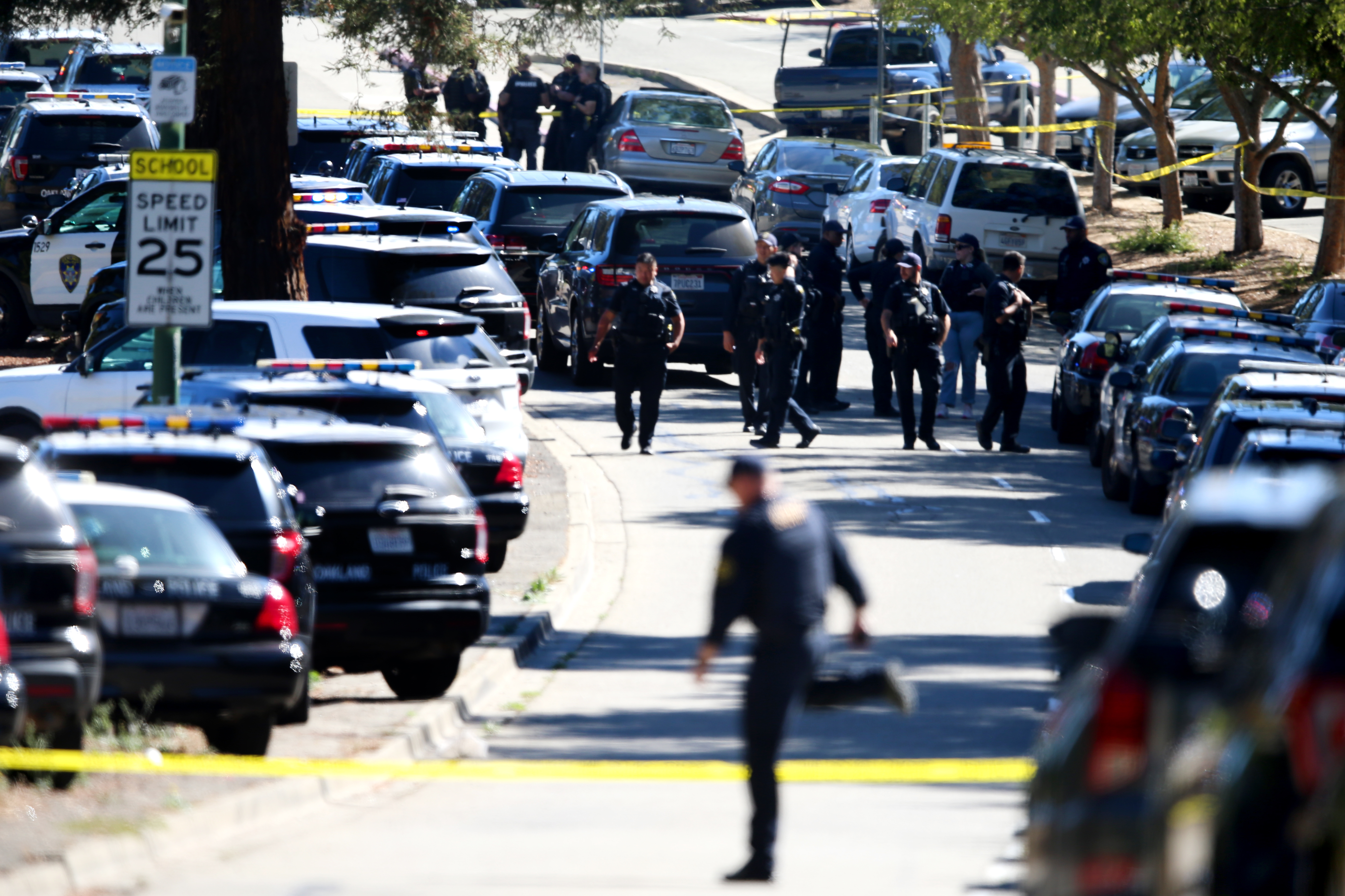 OAKLAND, CALIFORNIA - SEPTEMBER 28: Law enforcement officers from different agencies respond after a multiple people were shot in a complex of schools on Fontaine Street in Oakland, Calif., on Wednesday, Sept. 28, 2022. Ray Chavez/Bay Area News Group)