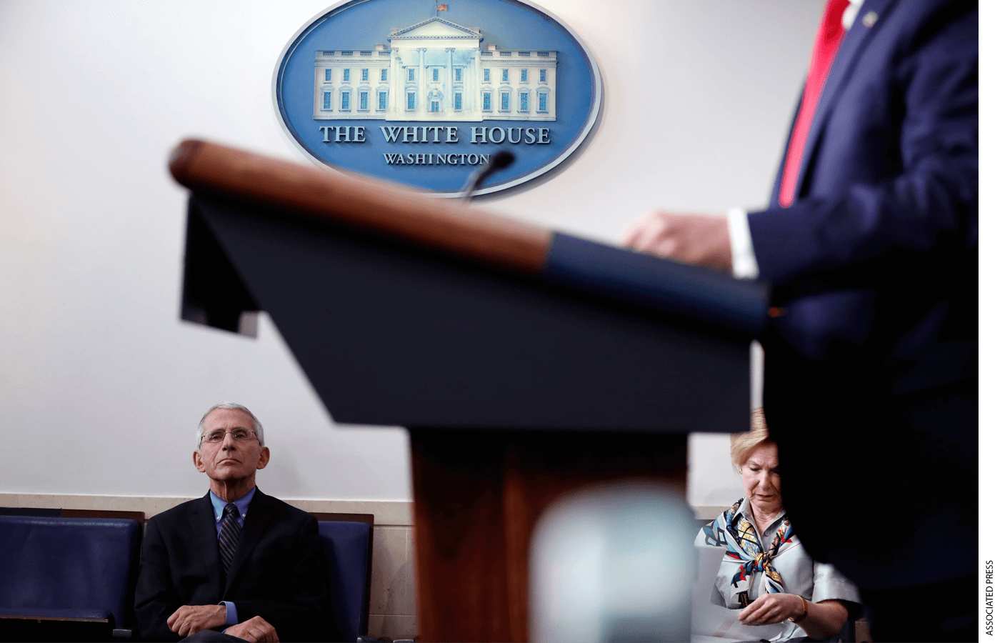 Dr. Anthony Fauci waits to take the podium after President Donald Trump addresses the White House press corps in April 2020, just weeks into the Covid-19 outbreak.