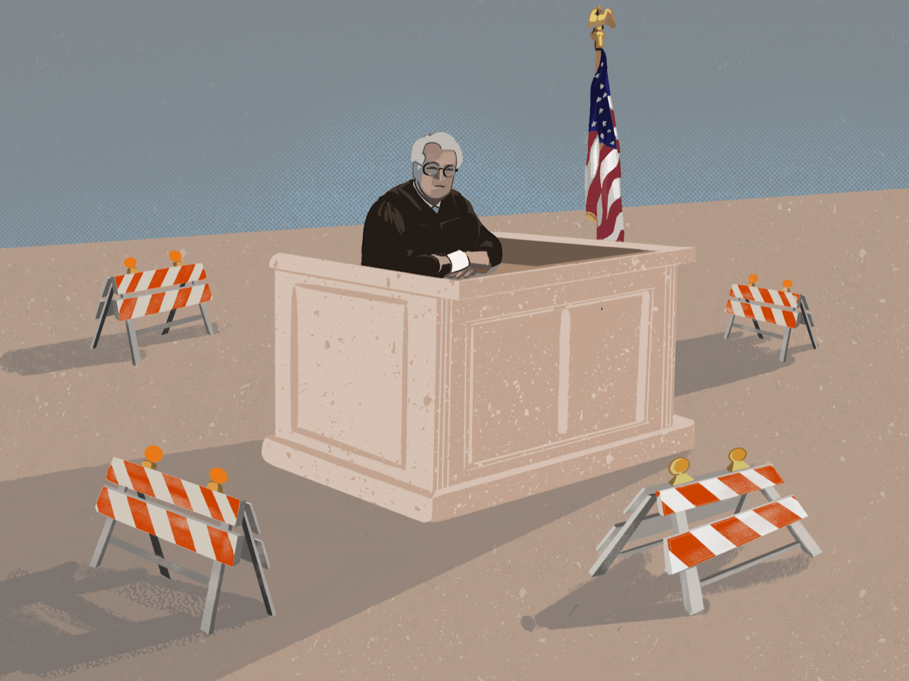 A judge sits on the bench surrounded by traffic barriers