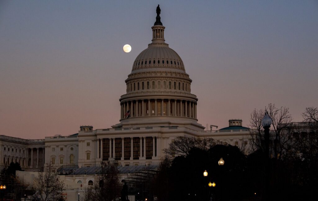 US Capitol building at sunset with moon