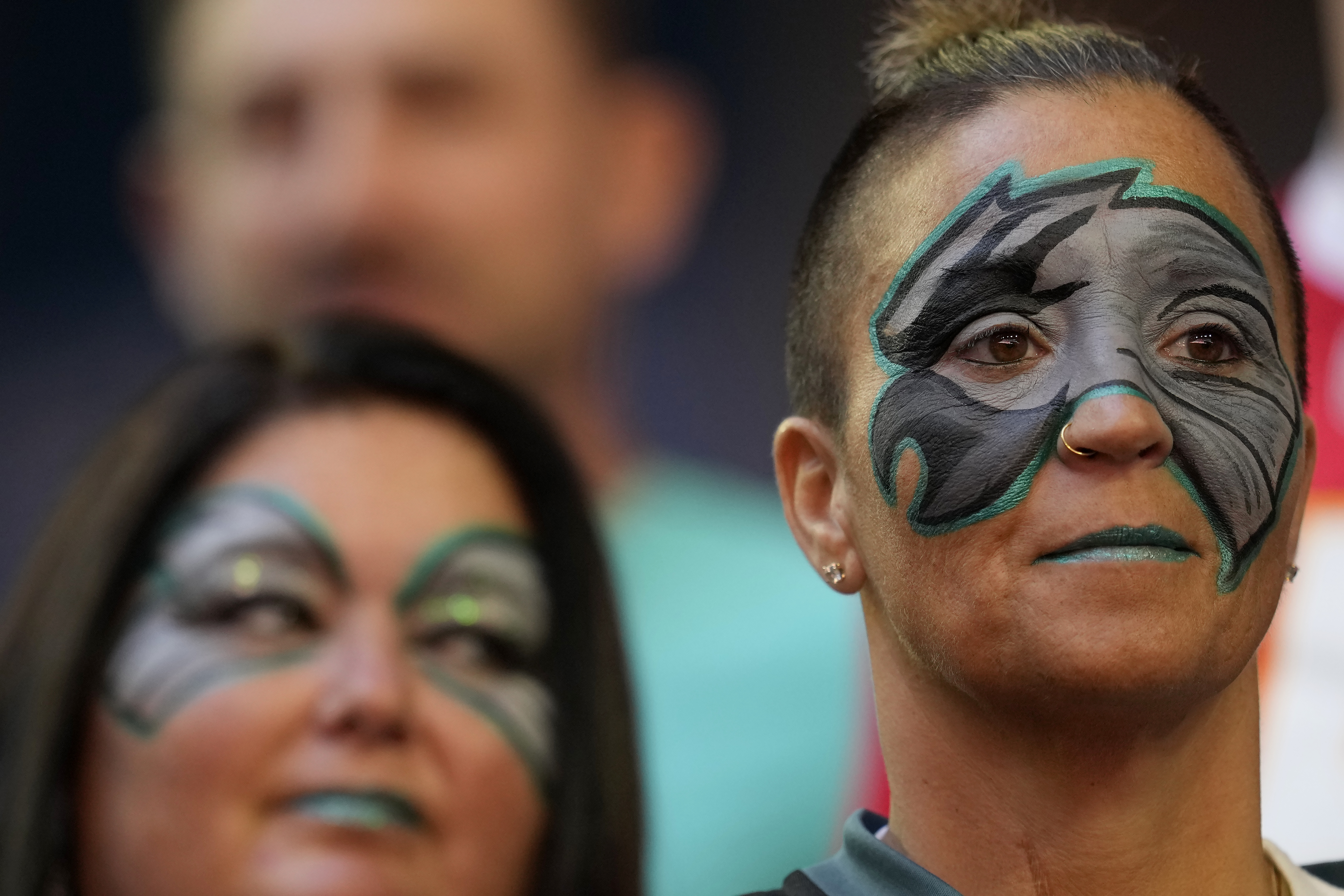 Philadelphia Eagles fans watch the teams warm up before the NFL Super Bowl 57 football game between the Kansas City Chiefs and the Philadelphia Eagles, Sunday, Feb. 12, 2023, in Glendale, Ariz. (AP Photo/Marcio J. Sanchez)