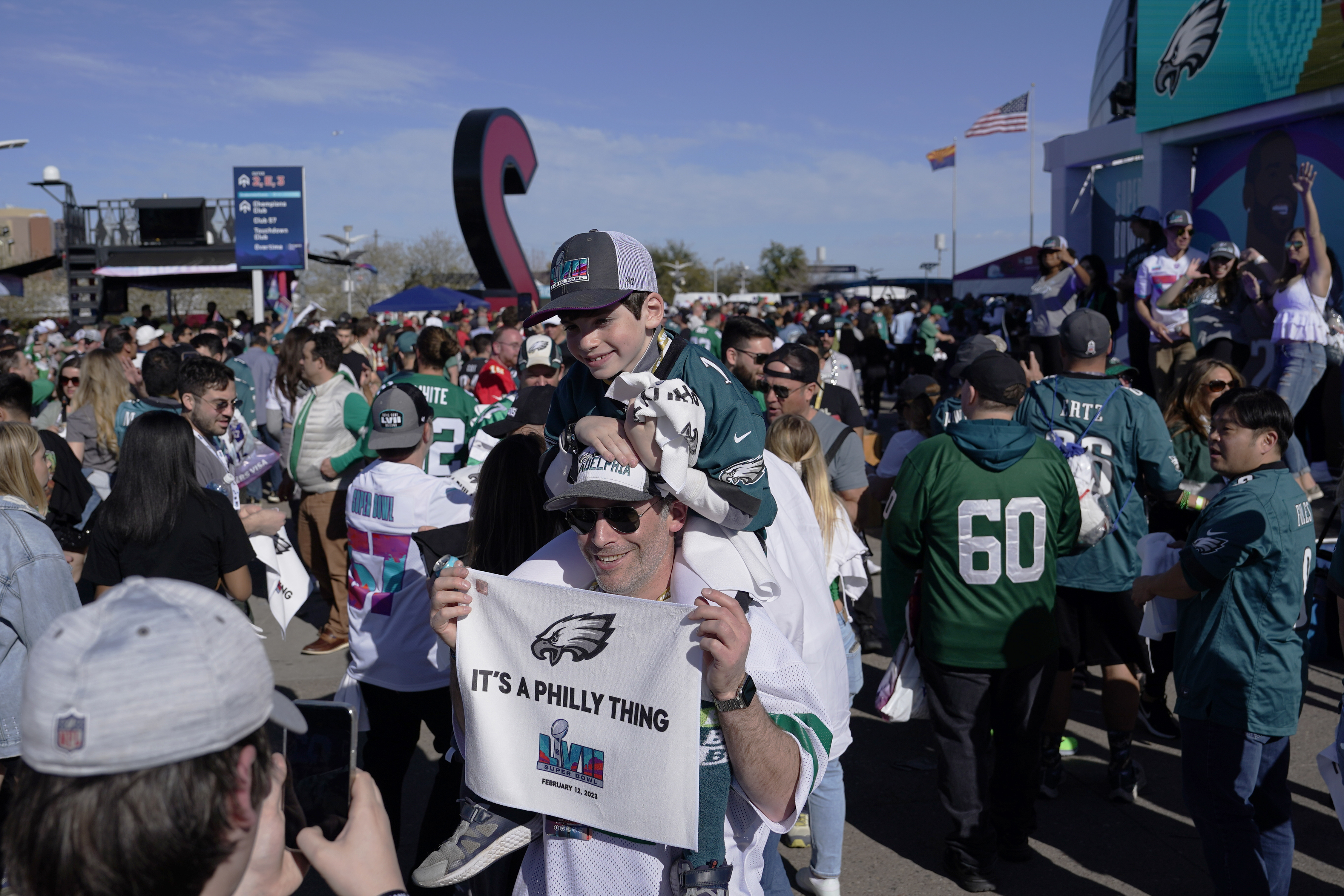 Fans arrive for the NFL Super Bowl 57 football game between the Kansas City Chiefs and the Philadelphia Eagles, Sunday, Feb. 12, 2023, in Glendale, Ariz. (AP Photo/Godofredo A. Vasquez)