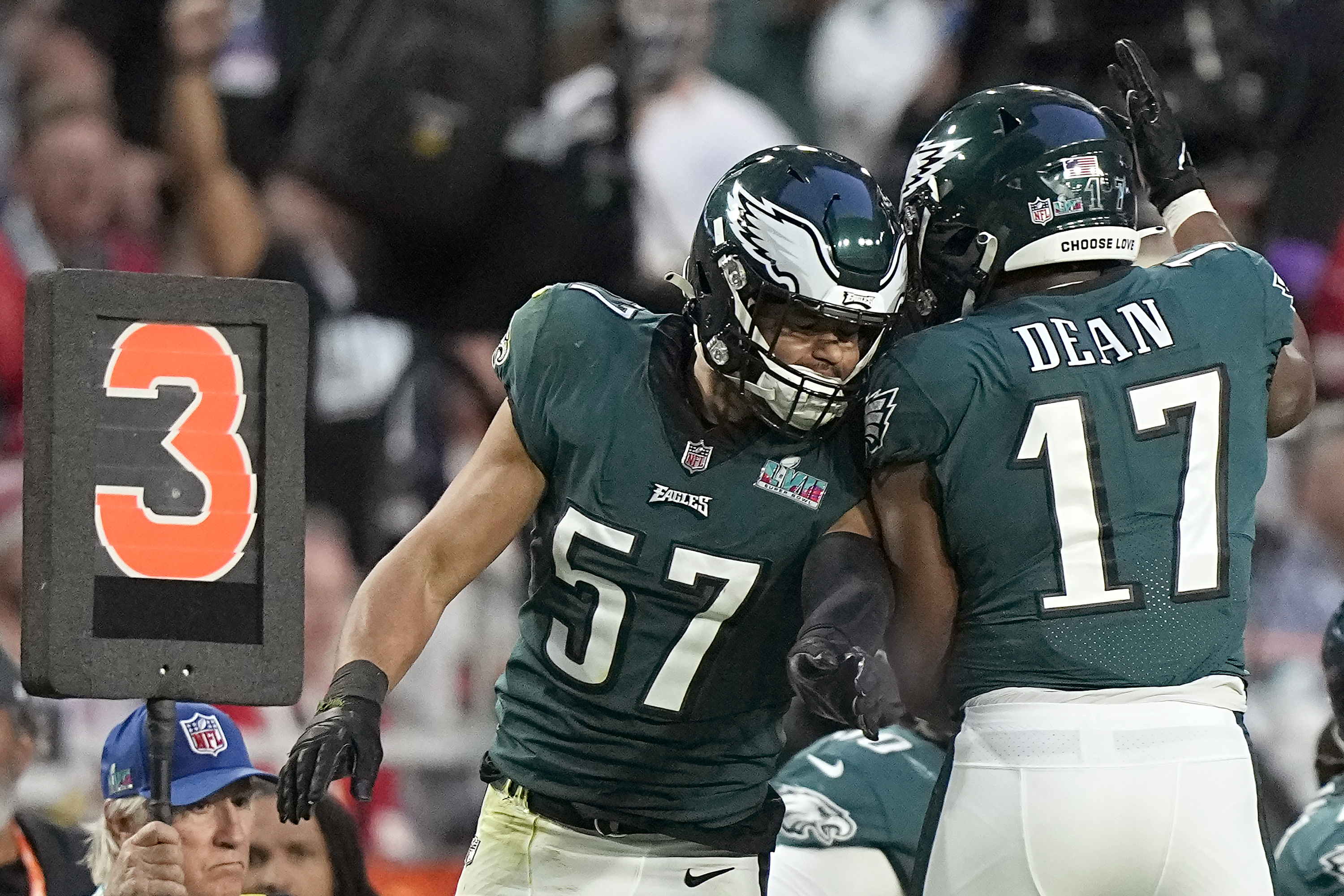 Philadelphia Eagles linebacker T.J. Edwards (57) celebrates with linebacker Nakobe Dean (17) after Edwards tackled Kansas City Chiefs quarterback Patrick Mahomes during the first half of the NFL Super Bowl 57 football game between the Kansas City Chiefs and the Philadelphia Eagles, Sunday, Feb. 12, 2023, in Glendale, Ariz. (AP Photo/Brynn Anderson)
