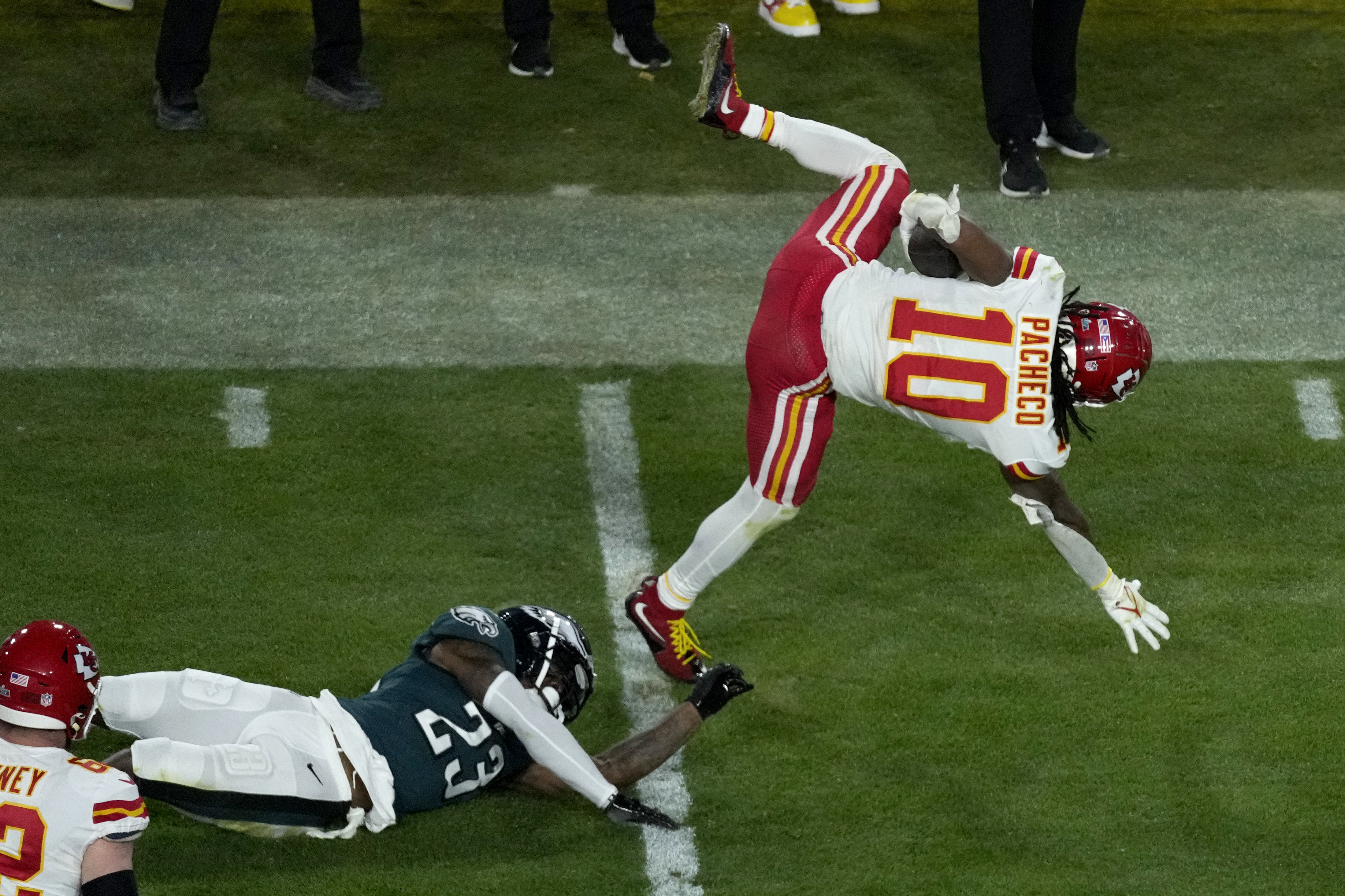 Kansas City Chiefs running back Isiah Pacheco (10) is up-ended by Philadelphia Eagles safety C.J. Gardner-Johnson (23) during the second half of the NFL Super Bowl 57 football game, Sunday, Feb. 12, 2023, in Glendale, Ariz. (AP Photo/Charlie Riedel)