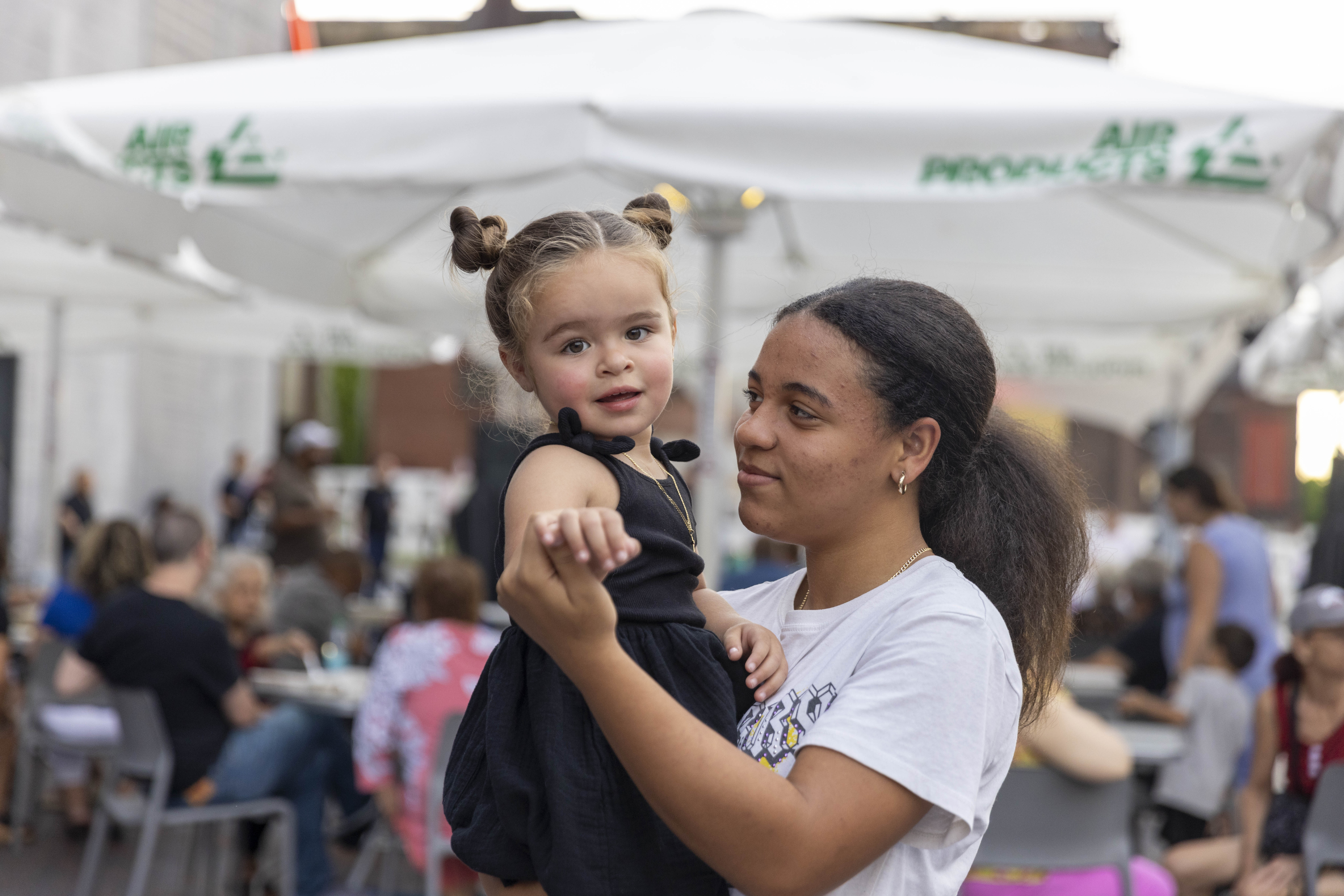 Germayony Perez holds Anaby Perez Friday, June 28, 2024, during the 13th annual ¡Sabor! Latin Festival at SteelStacks in Bethlehem. The festival is a celebration of Latin heritage including music, food and family fun. (Emma Reed/The Morning Call)