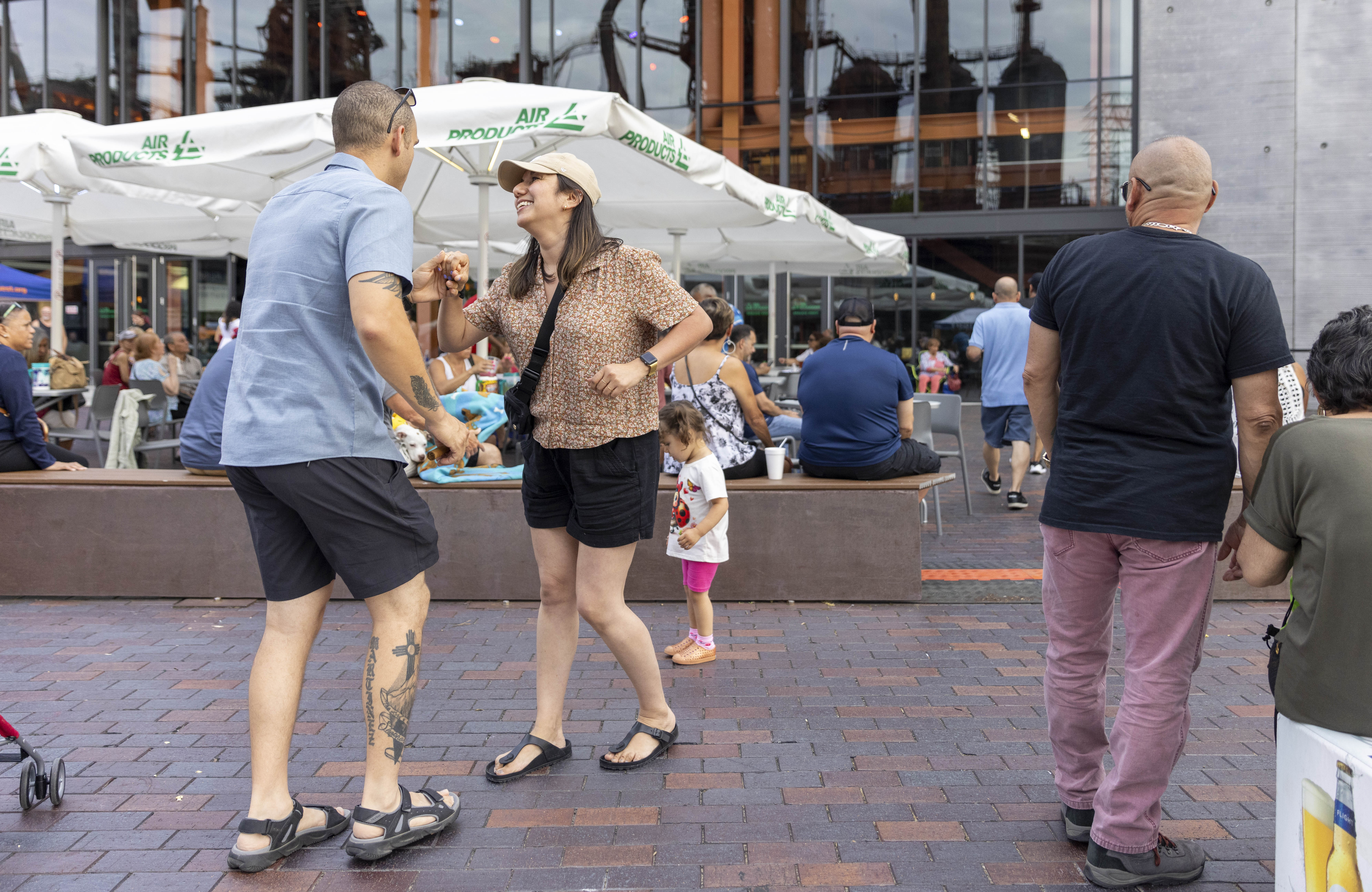 Orlando Franqui, left, dances with Nadienka Franqui Friday, June 28, 2024, during the 13th annual ¡Sabor! Latin Festival at SteelStacks in Bethlehem. The festival is a celebration of Latin heritage including music, food and family fun. (Emma Reed/The Morning Call)