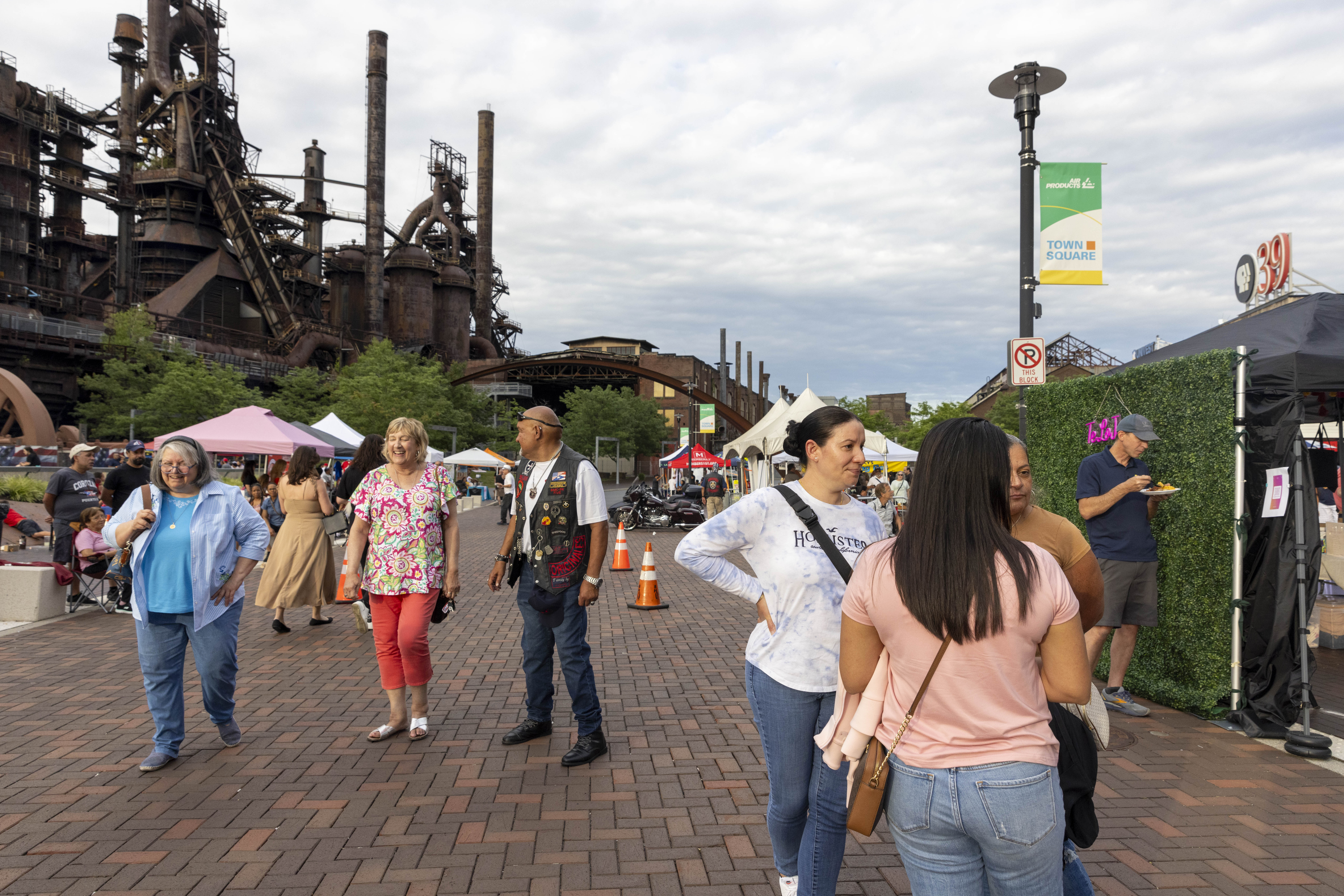 Attendees of the 13th annual ¡Sabor! Latin Festival explore vendor's offerings Friday, June 28, 2024, at SteelStacks in Bethlehem. The festival is a celebration of Latin heritage including music, food and family fun. (Emma Reed/The Morning Call)