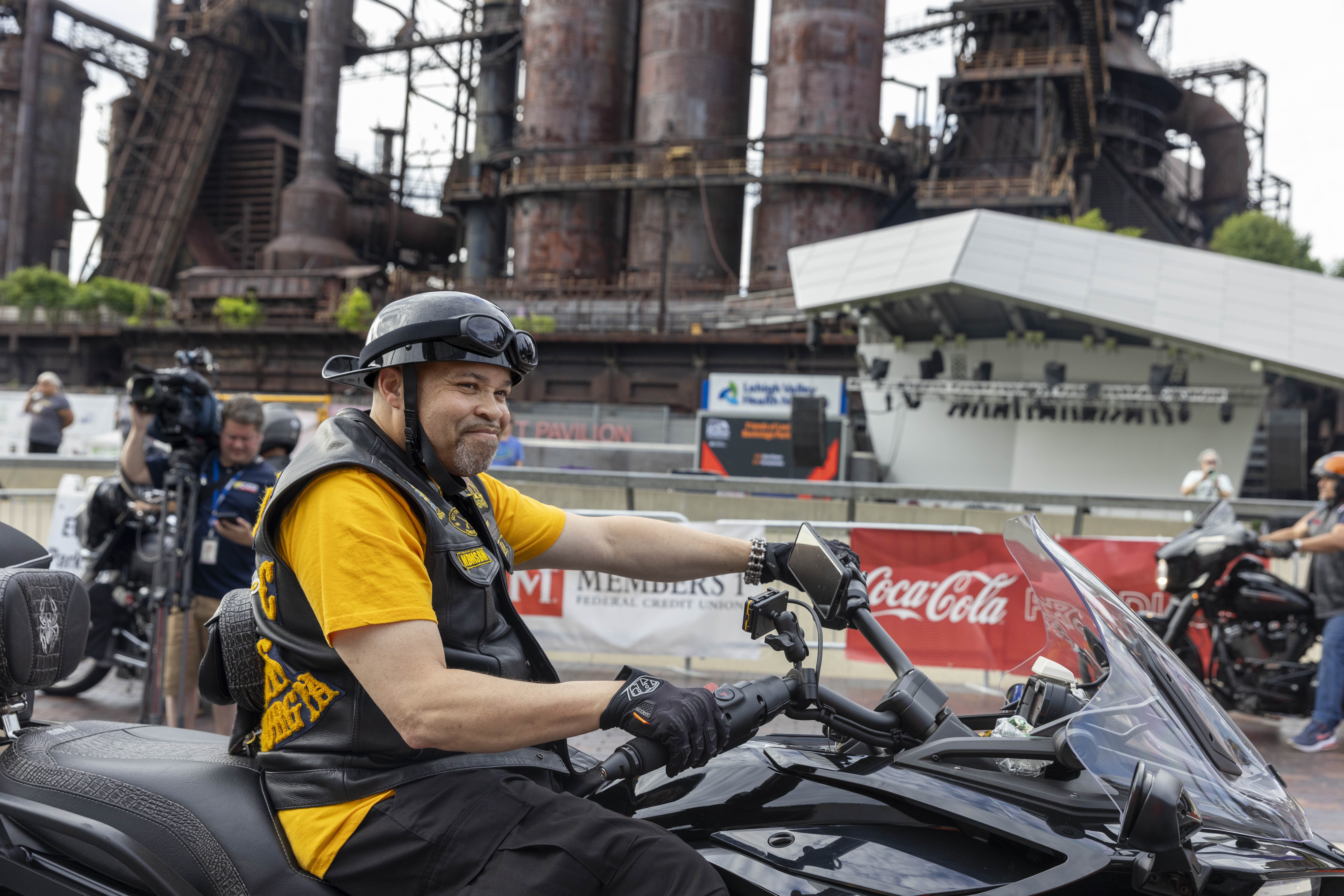 Members of The Buffalo Soldiers ride around SteelStacks on Friday, June 28, 2024, during the 13th annual ¡Sabor! Latin Festival in Bethlehem. The festival is a celebration of Latin heritage including music, food and family fun. (Emma Reed/The Morning Call)