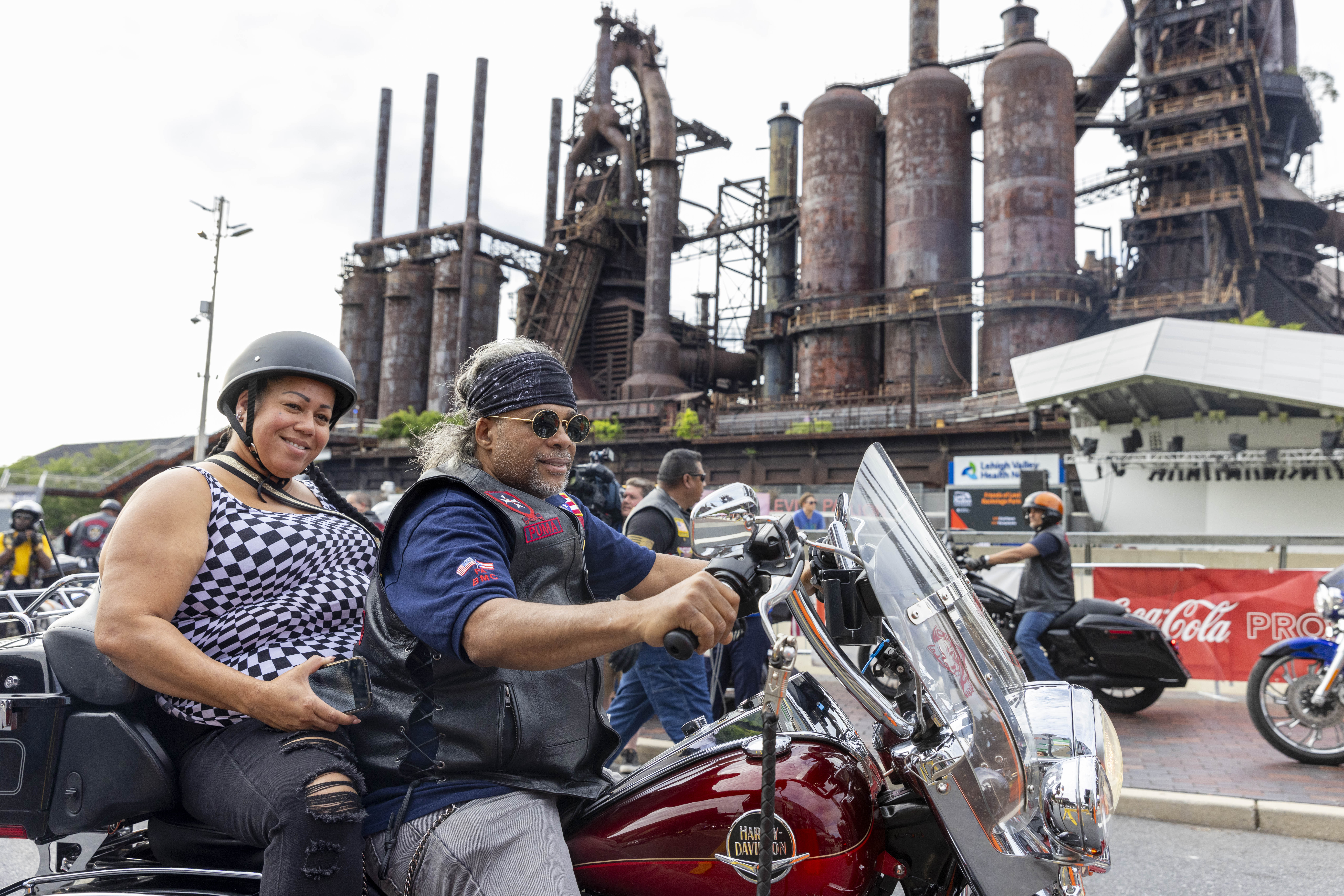 Members of The Borinqueneers ride around SteelStacks on Friday, June 28, 2024, during the 13th annual ¡Sabor! Latin Festival in Bethlehem. The festival is a celebration of Latin heritage including music, food and family fun. (Emma Reed/The Morning Call)