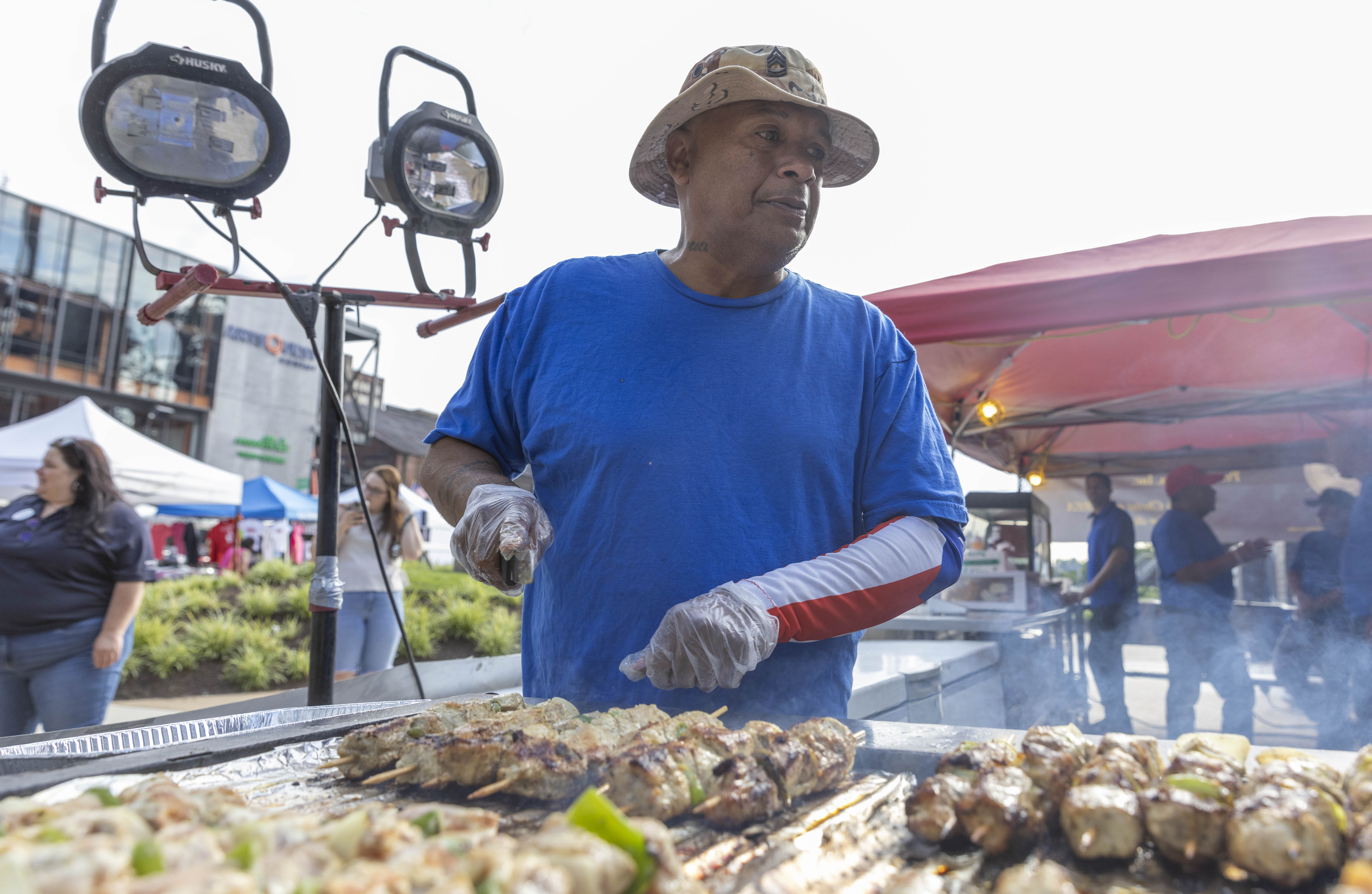 A vendor prepares food for visitors to the 13th annual ¡Sabor! Latin Festival on Friday, June 28, 2024, at SteelStacks in Bethlehem. The festival is a celebration of Latin heritage including music, food and family fun. (Emma Reed/The Morning Call)