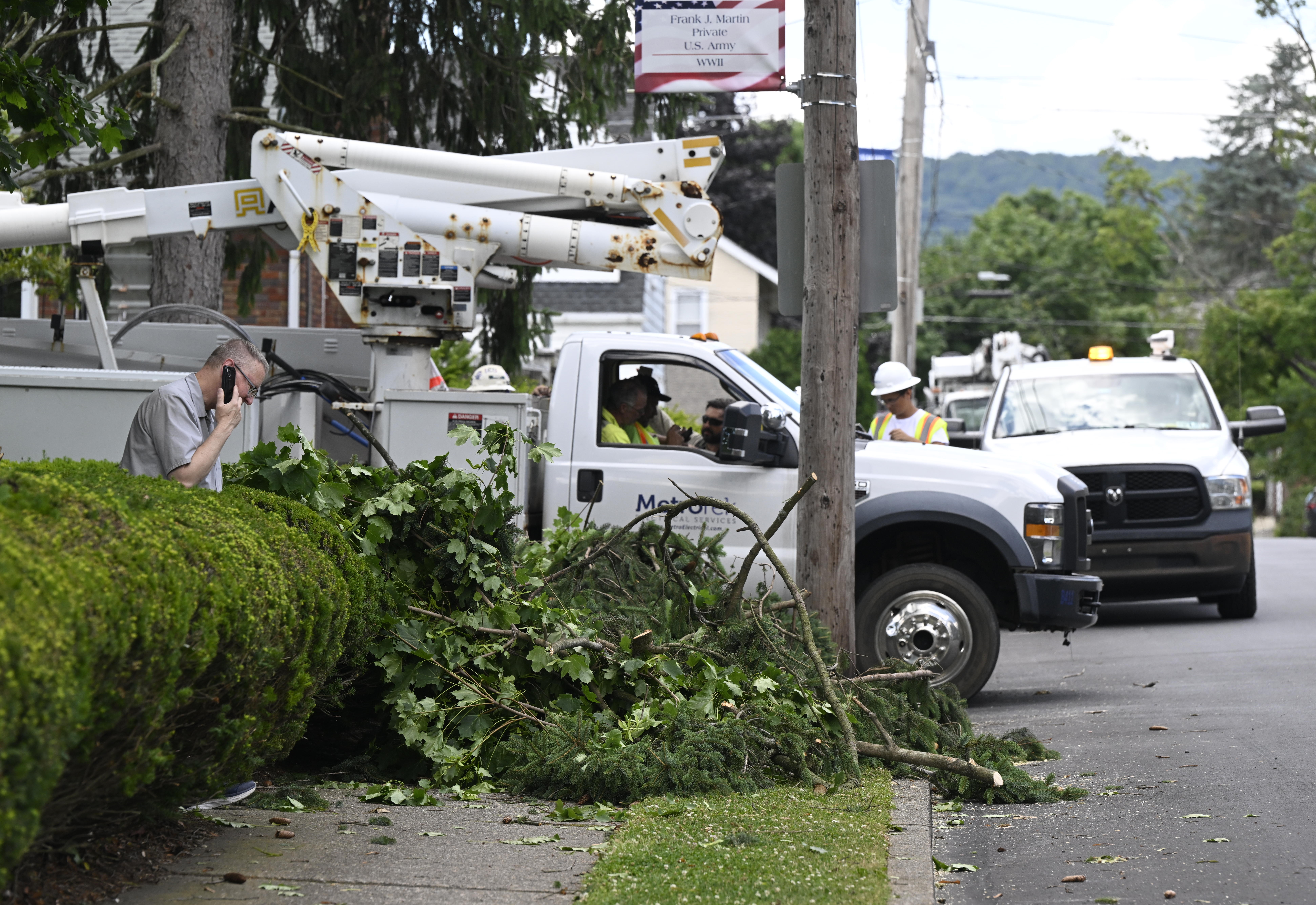 Clean up continues Thursday, June 27, 2024, in Hellertown after a severe thunderstorm with nearly 60 mph wind gusts ripped through the Lehigh Valley the night before. (Monica Cabrera/The Morning Call)