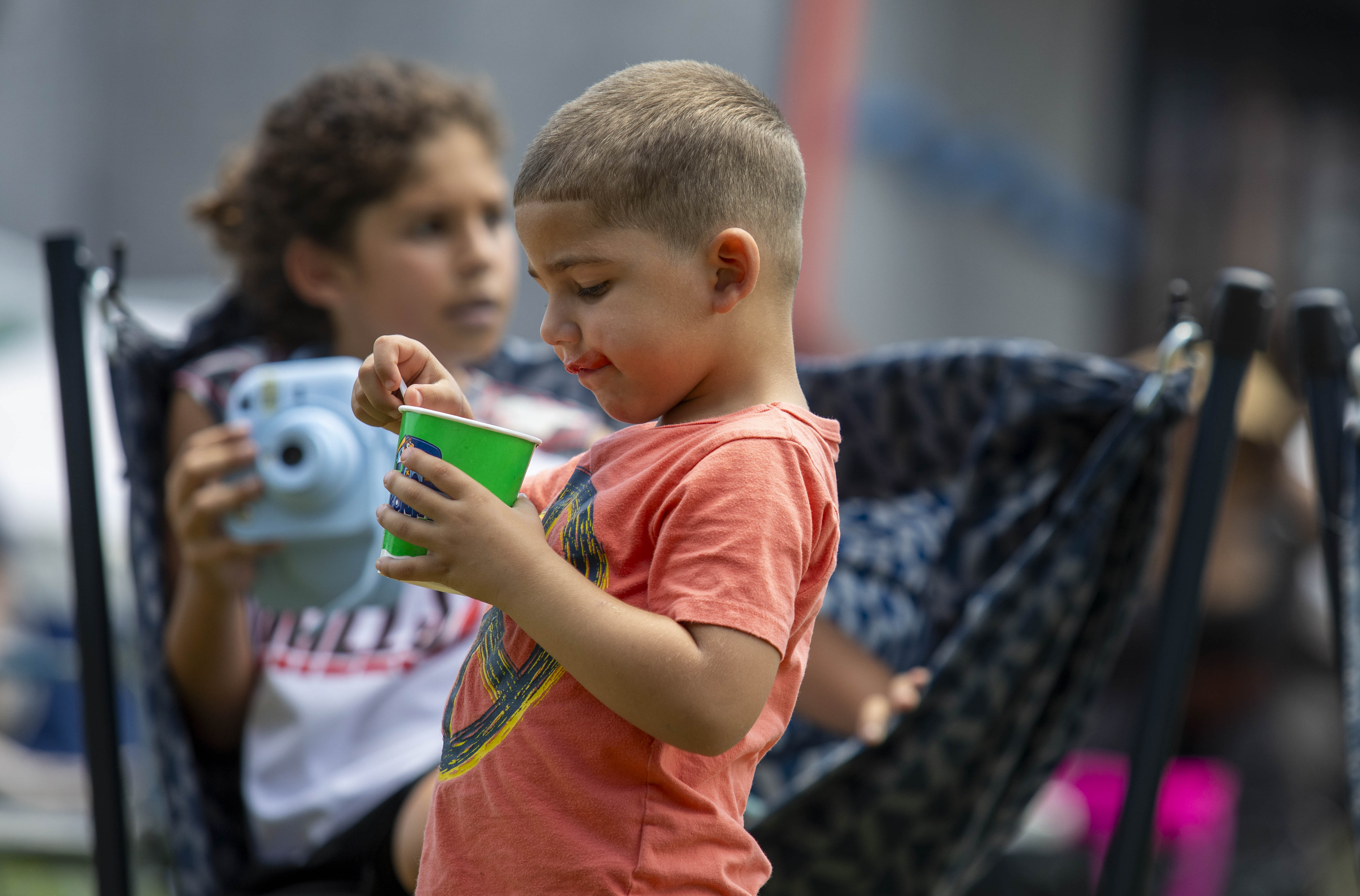 Avian Viola eats shave ice Saturday, July 6, 2024, during the One Earth ReggaeFest at SteelStacks in Bethlehem. (Emma Reed/The Morning Call)