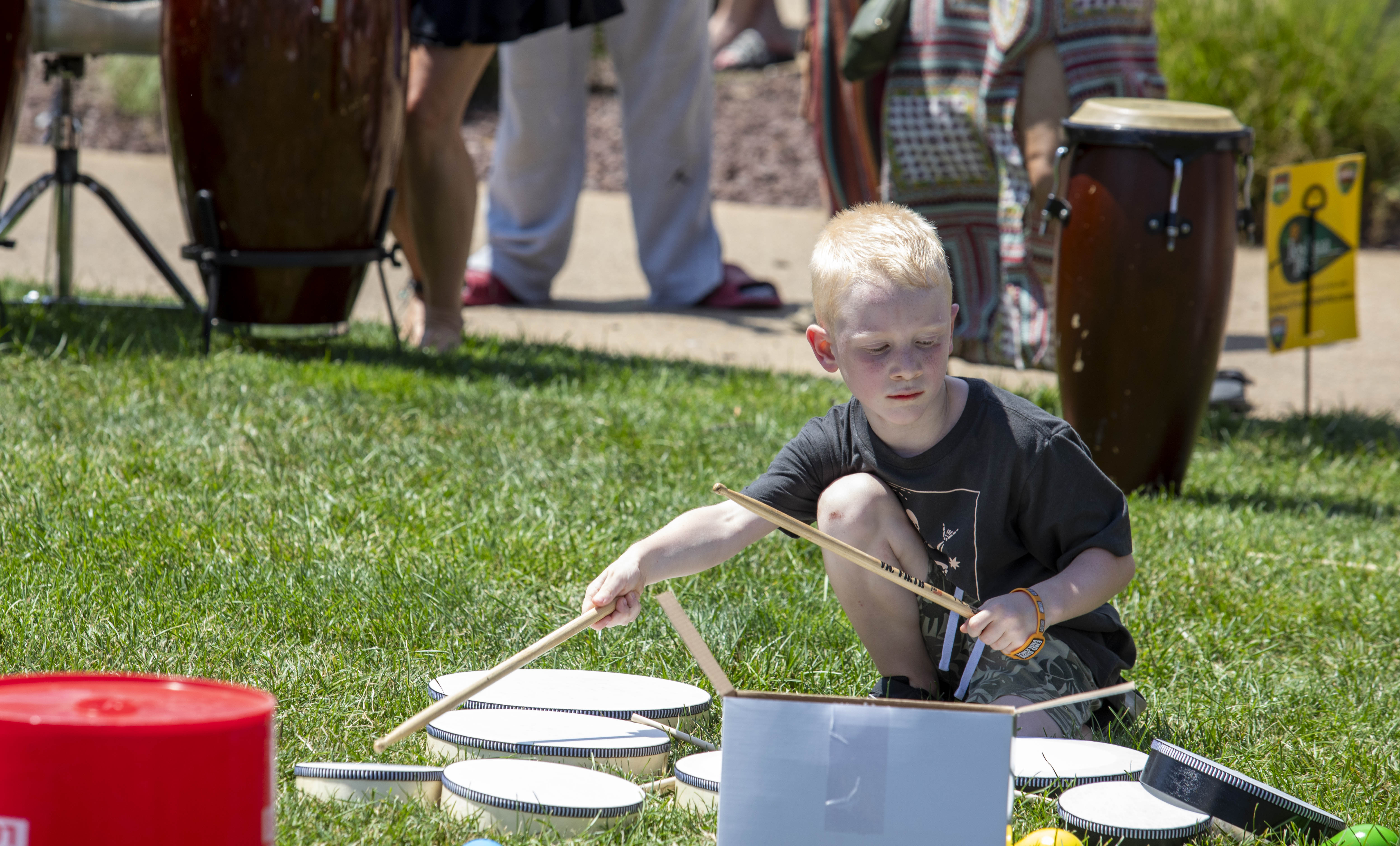 Liam Koval plays in a drum circle Saturday, July 6, 2024, during the One Earth ReggaeFest at SteelStacks in Bethlehem. (Emma Reed/The Morning Call)