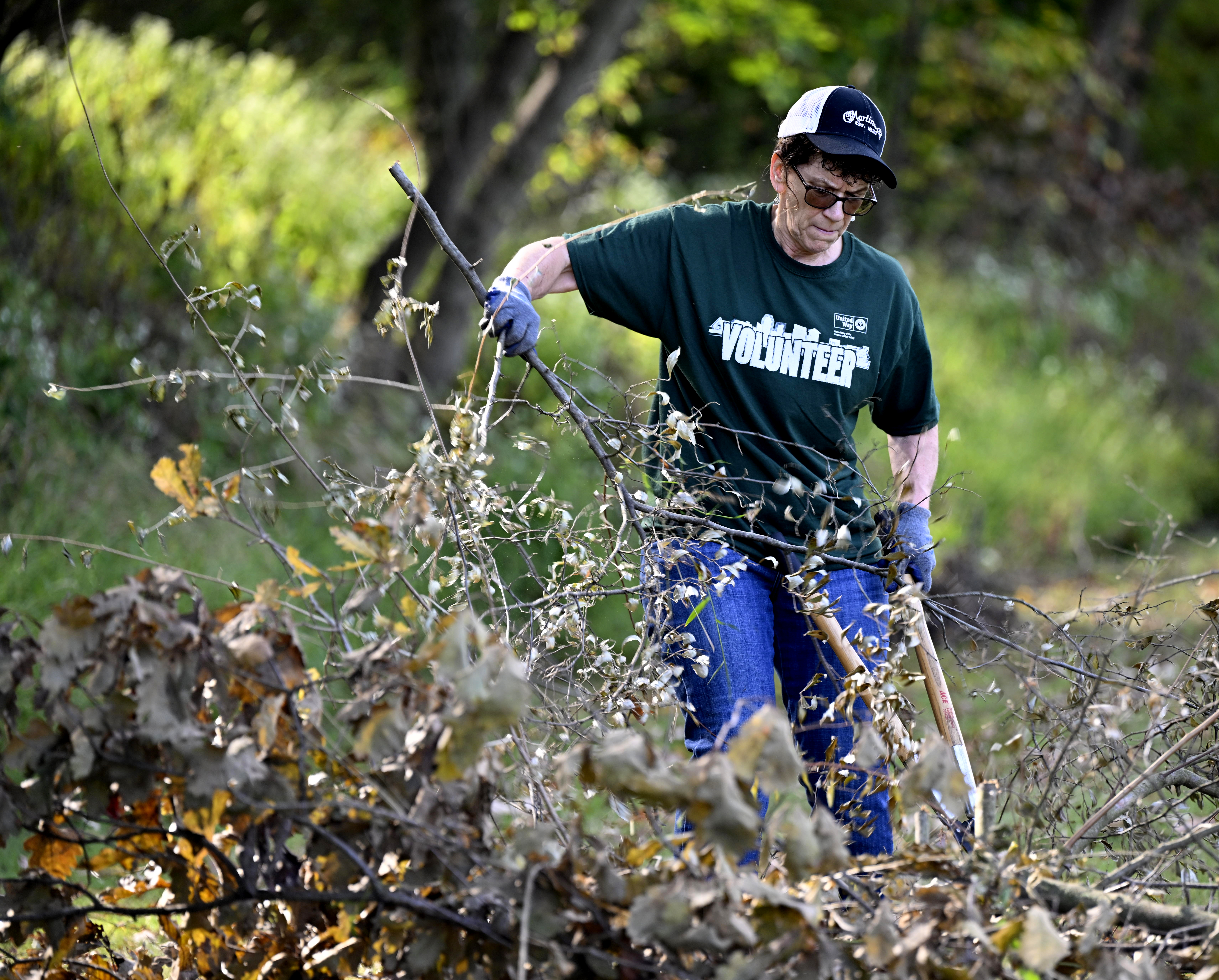 Linda Matyas of Bethlehem, an employee of C.F. Martin & Co., does yard work and landscapes Thursday, Sept. 19, 2024, at the Hellertown Historical Society property on Walnut Street in Hellertown. Approximately 2,300 volunteers from 54 area businesses completed community service projects at dozens of nonprofits throughout Lehigh and Northampton counties during the annual Day of Caring, organized by the United Way of the Greater Lehigh Valley. (Monica Cabrera/The Morning Call)