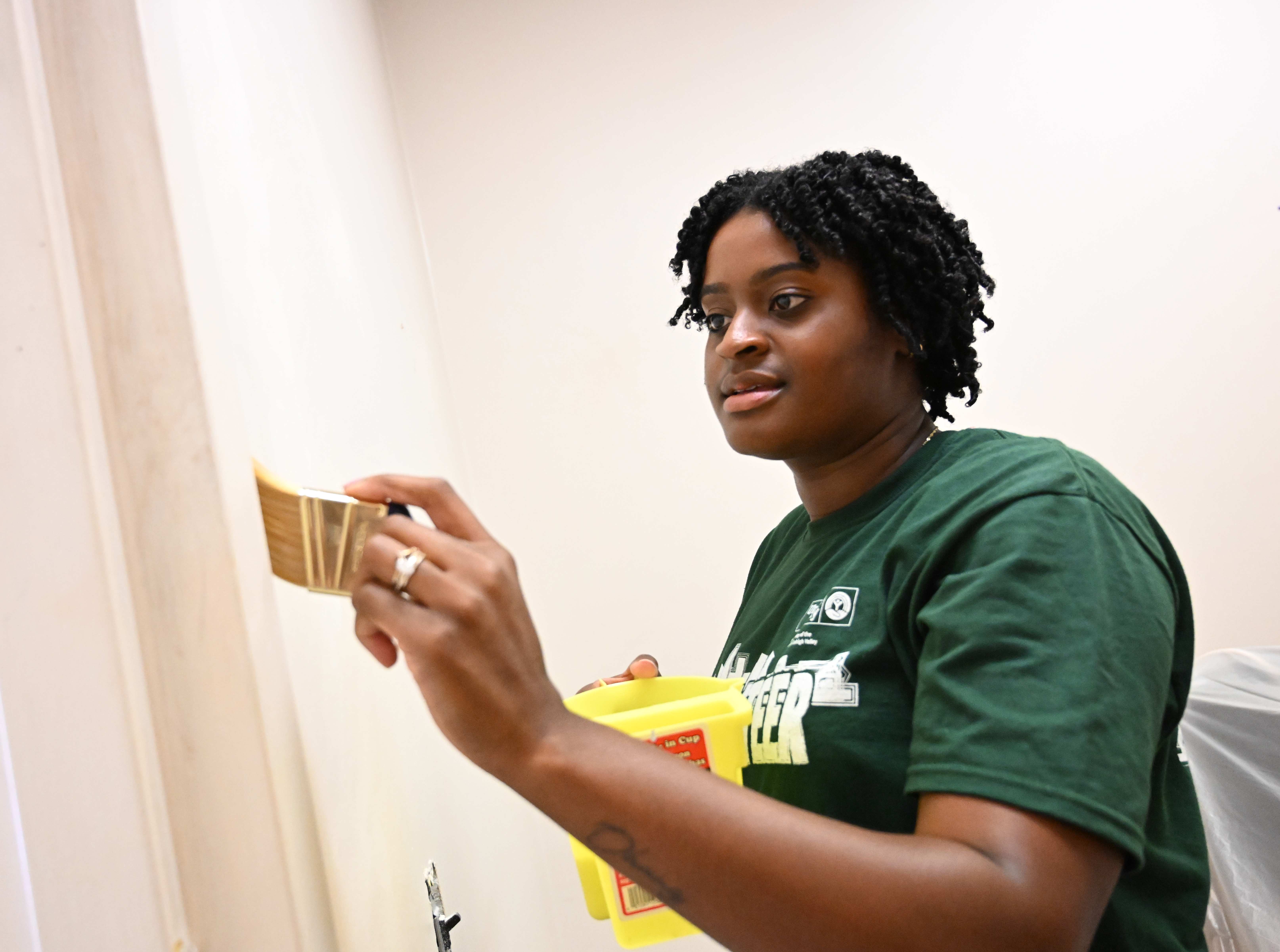 Brittany Keal, of the Lehigh Valley Chamber of Commerce, paints an office Thursday, Sept. 19, 2024, at the Boys & Girls Club of Allentown during the United Way of the Greater Lehigh Valley's 31st annual Day of Caring. Approximately 2,300 volunteers from 54 area businesses completed community service projects at dozens of nonprofits throughout Lehigh and Northampton counties. (Amy Shortell/The Morning Call)