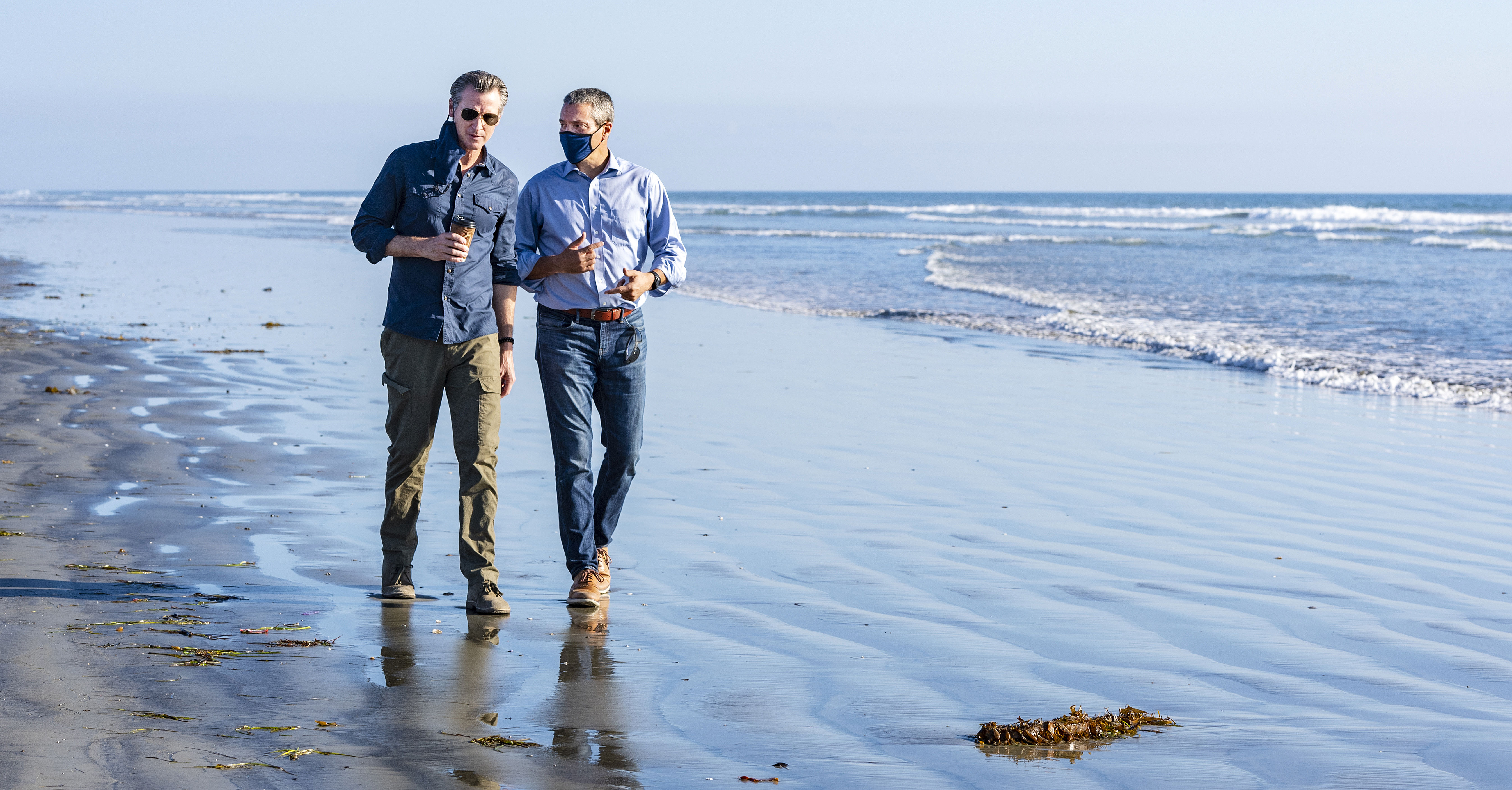 Gavin Newsom, Wade Crowfoot walk on beach