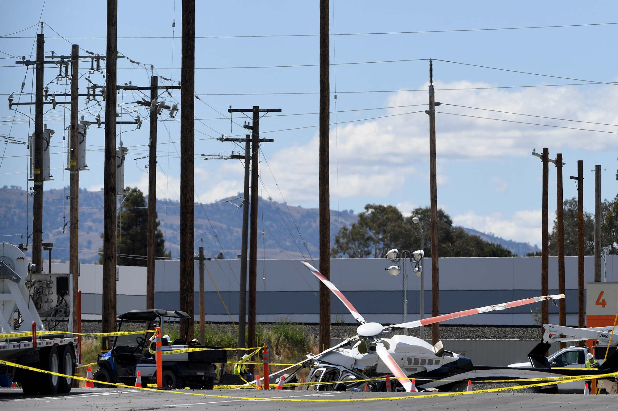 LIVERMORE, CA - MAY 11: A Pacific Gas & Electric helicopter crashed at a training facility on National Drive in Livermore, Calif., on Wednesday, May 11, 2022. Two men were injured in the crash and are expected to survive, according to the Livermore Police Department. (Doug Duran/Bay Area News Group)