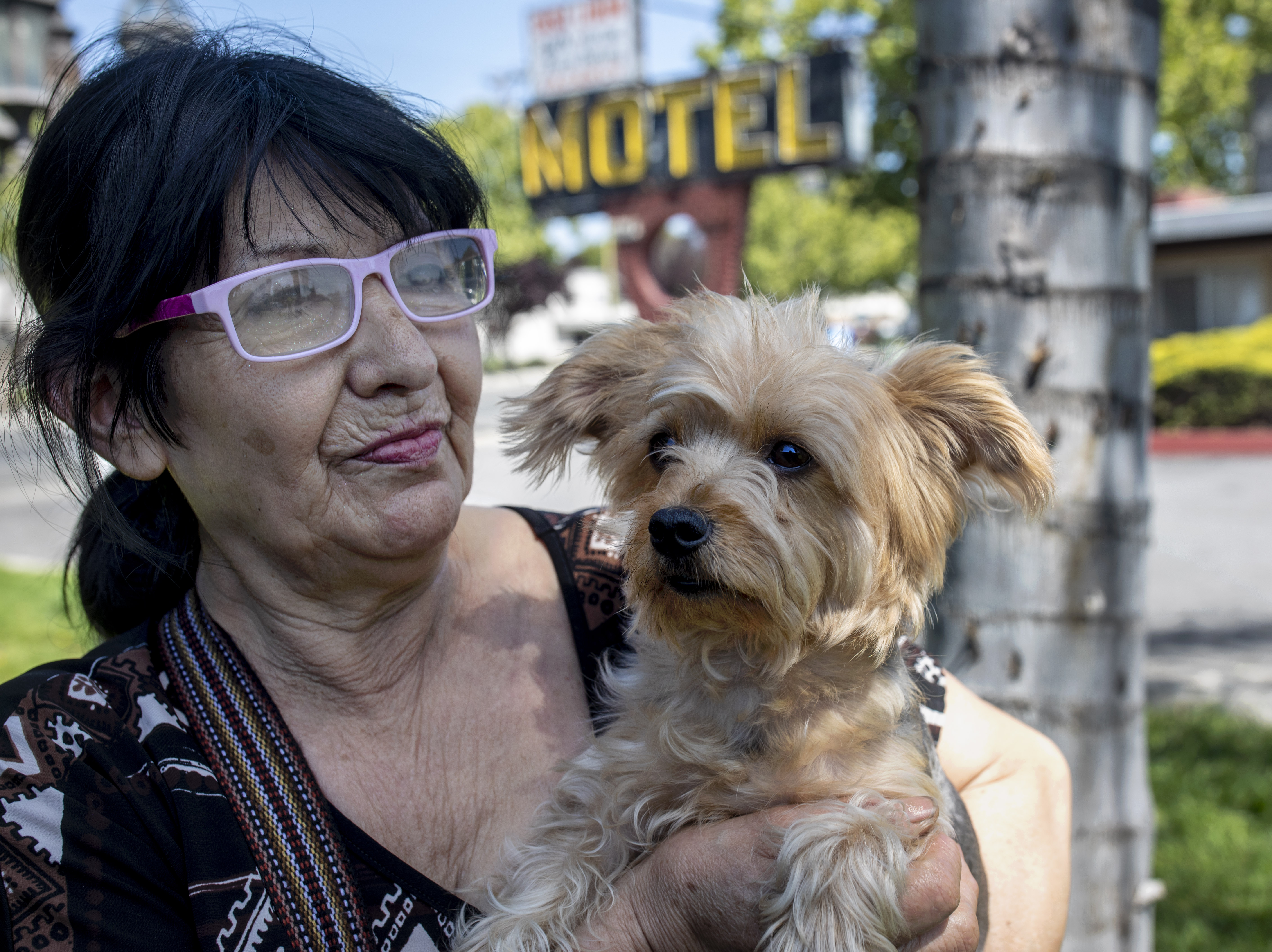 Bertha Iglesias holds her dog Ultima