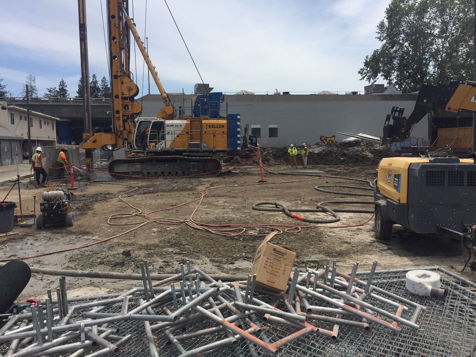 Workers and construction machinery at the project site of Garden Gate Tower, a housing highrise totaling 336 units at 600 S. First St. in downtown San Jose's SoFA district.(George Avalos/Bay Area News Group)