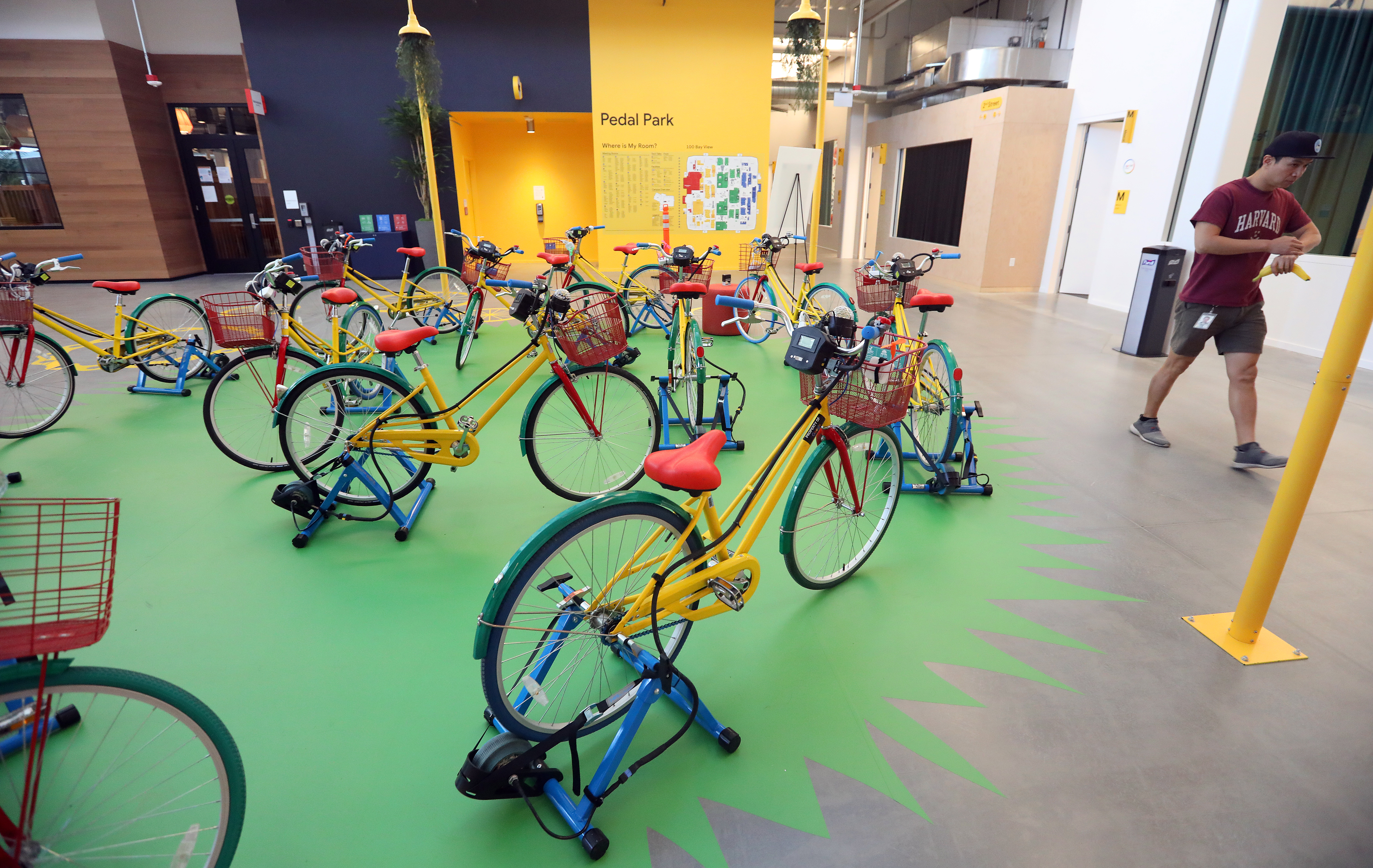 A Google employee walks past a bicycle staging area