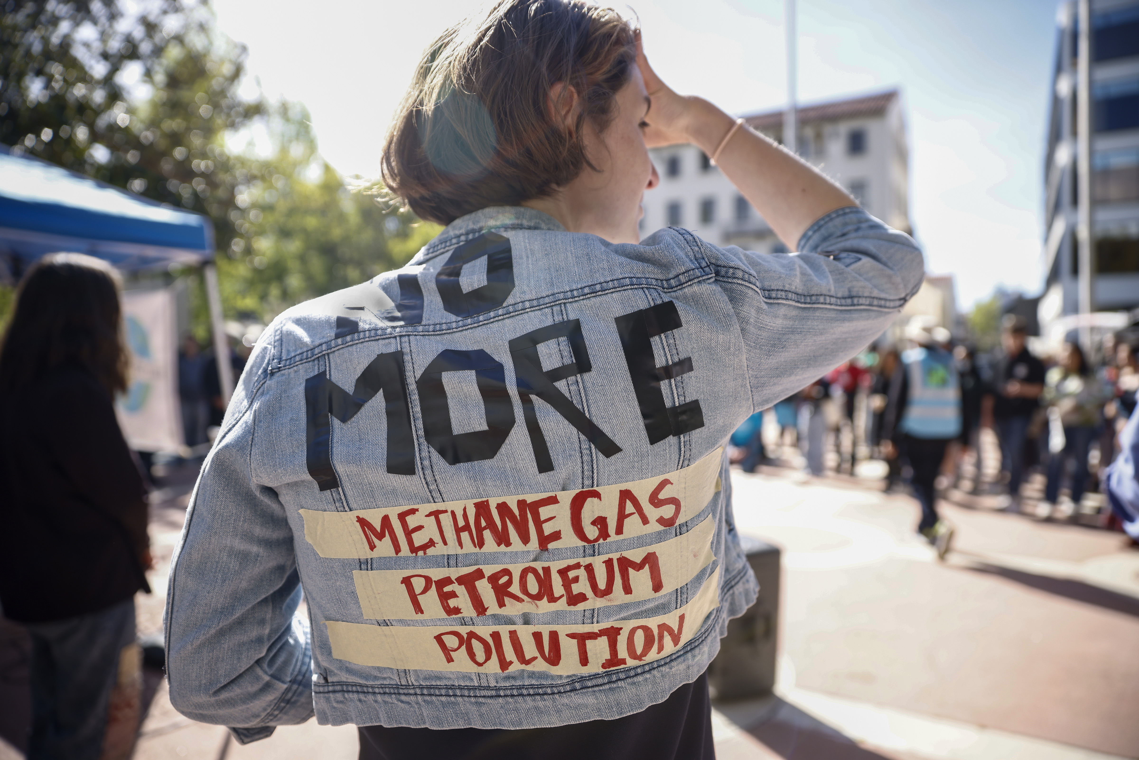 Jo Gardias, of Palo Alto, speaks to the crowd during an Earth Day march in Palo Alto, Calif., Friday, April 22, 2022.