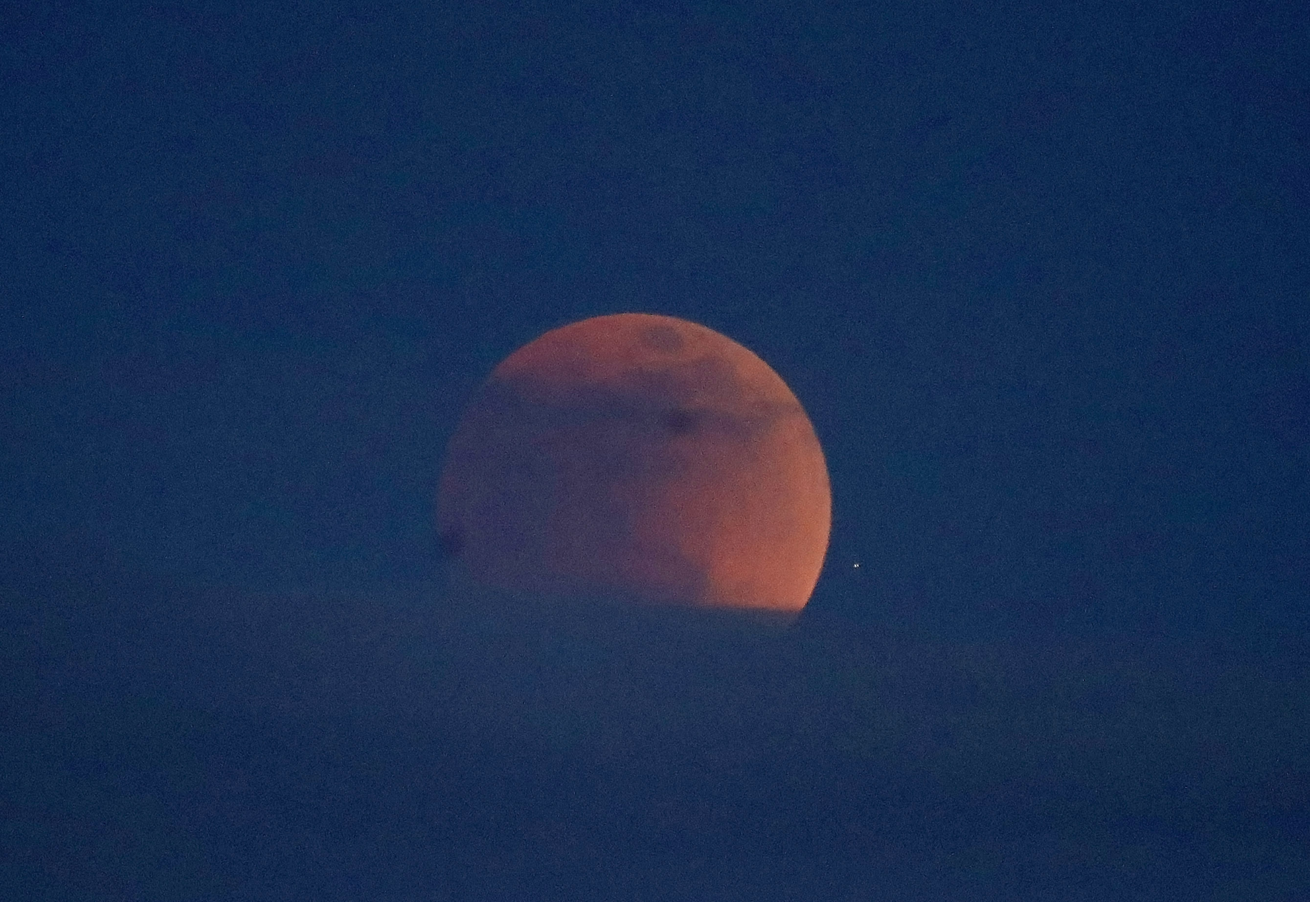 The first blood moon of the year is seen in Oakland, Calif.
