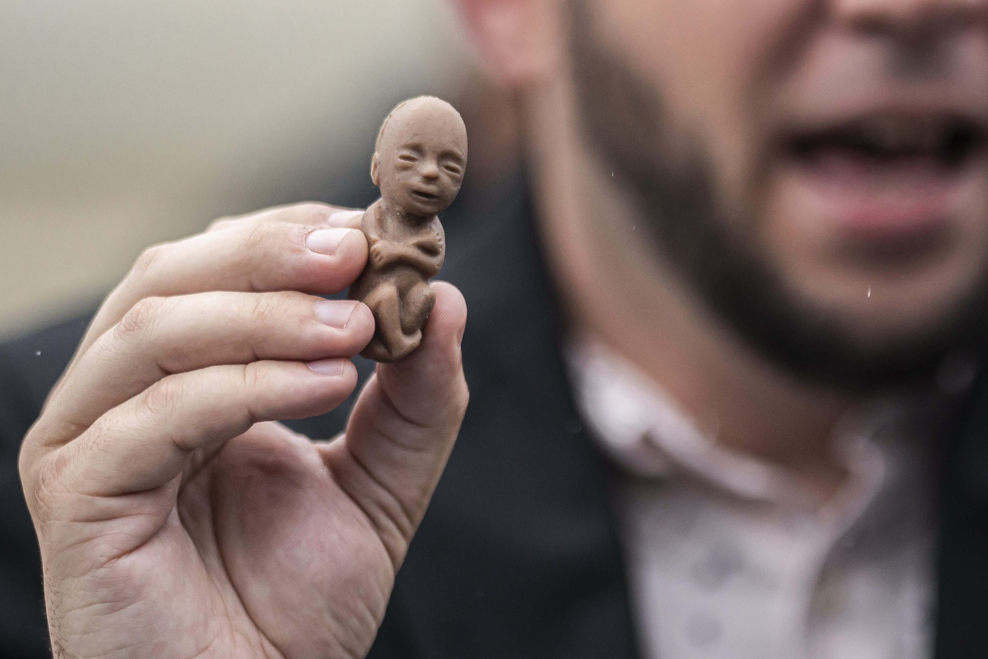 An anti-abortion activist holds a plastic fetus during a rally in front of the Supreme Court on June 23, 2022 in Washington, DC. (Photo by Nathan Howard/Getty Images)