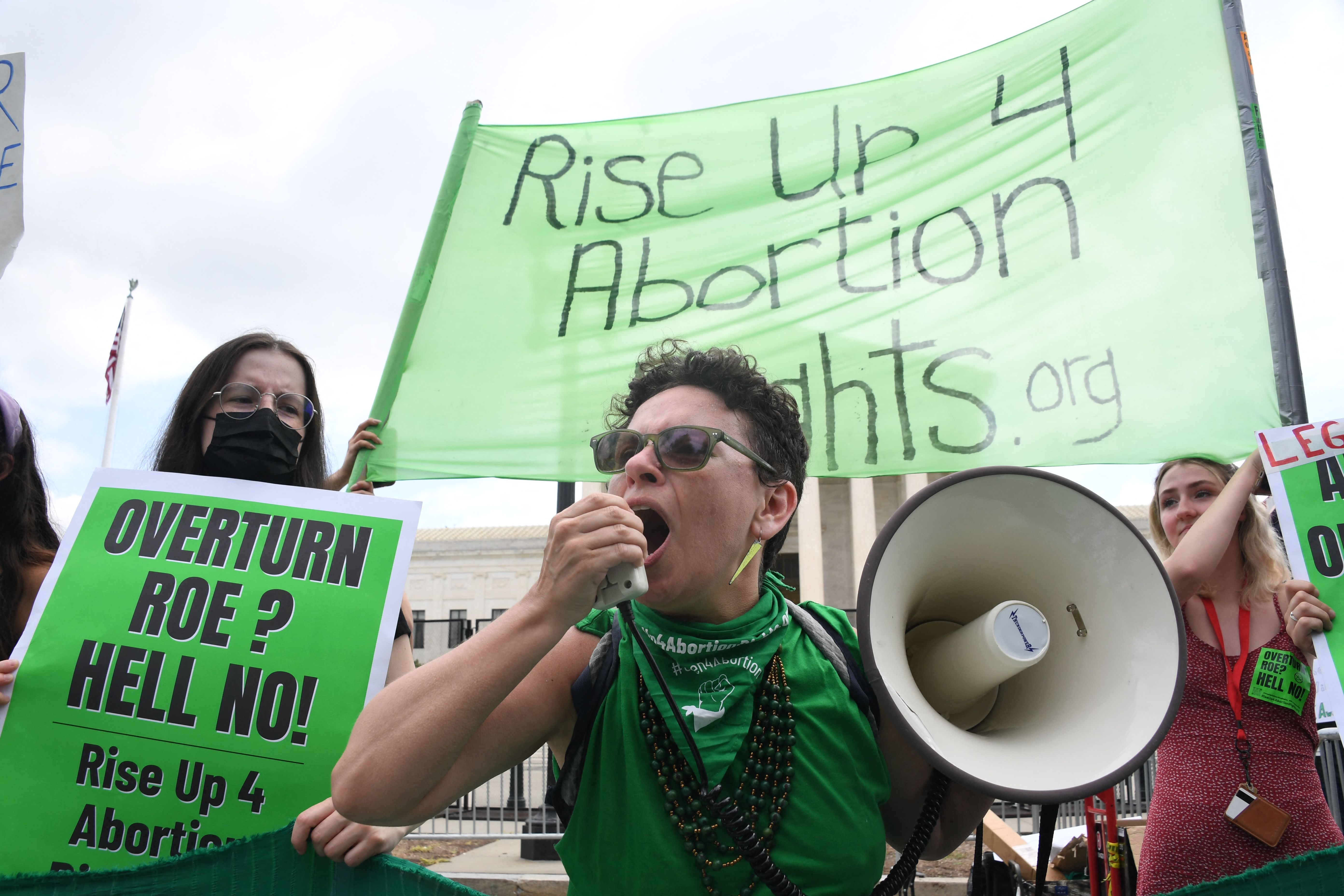 Pro-choice supporters react outside the US Supreme Court in Washington, DC, on June 24, 2022. (Photo by Olivier Douliery/AFP via Getty Images)