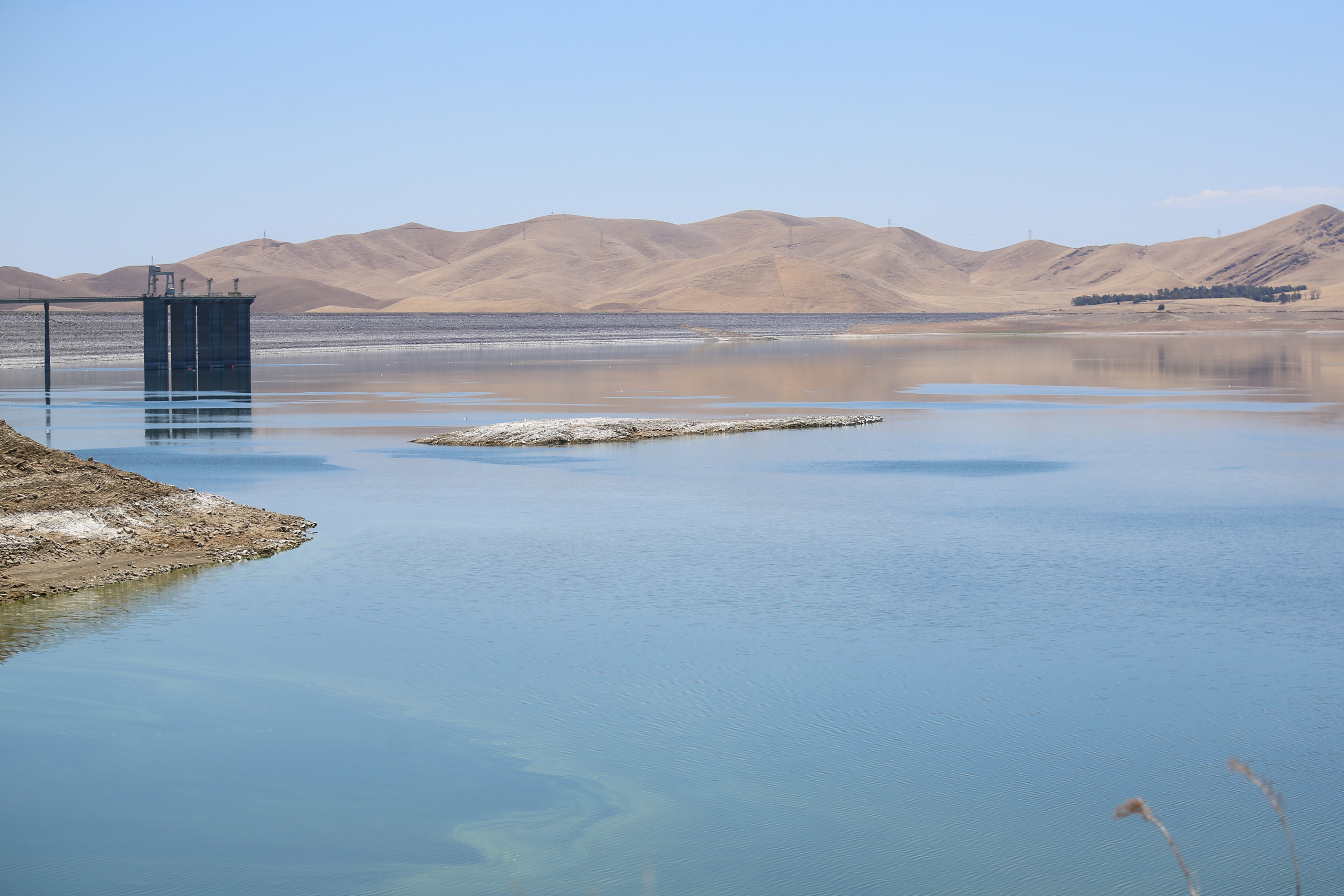 San Luis Reservoir near Highway 152 between Gilroy and Los Banos on Friday, June 24, 2022. Water officials hope to build the 382-foot earthen dam higher to expand its storage. (Shae Hammond/Bay Area News Group)