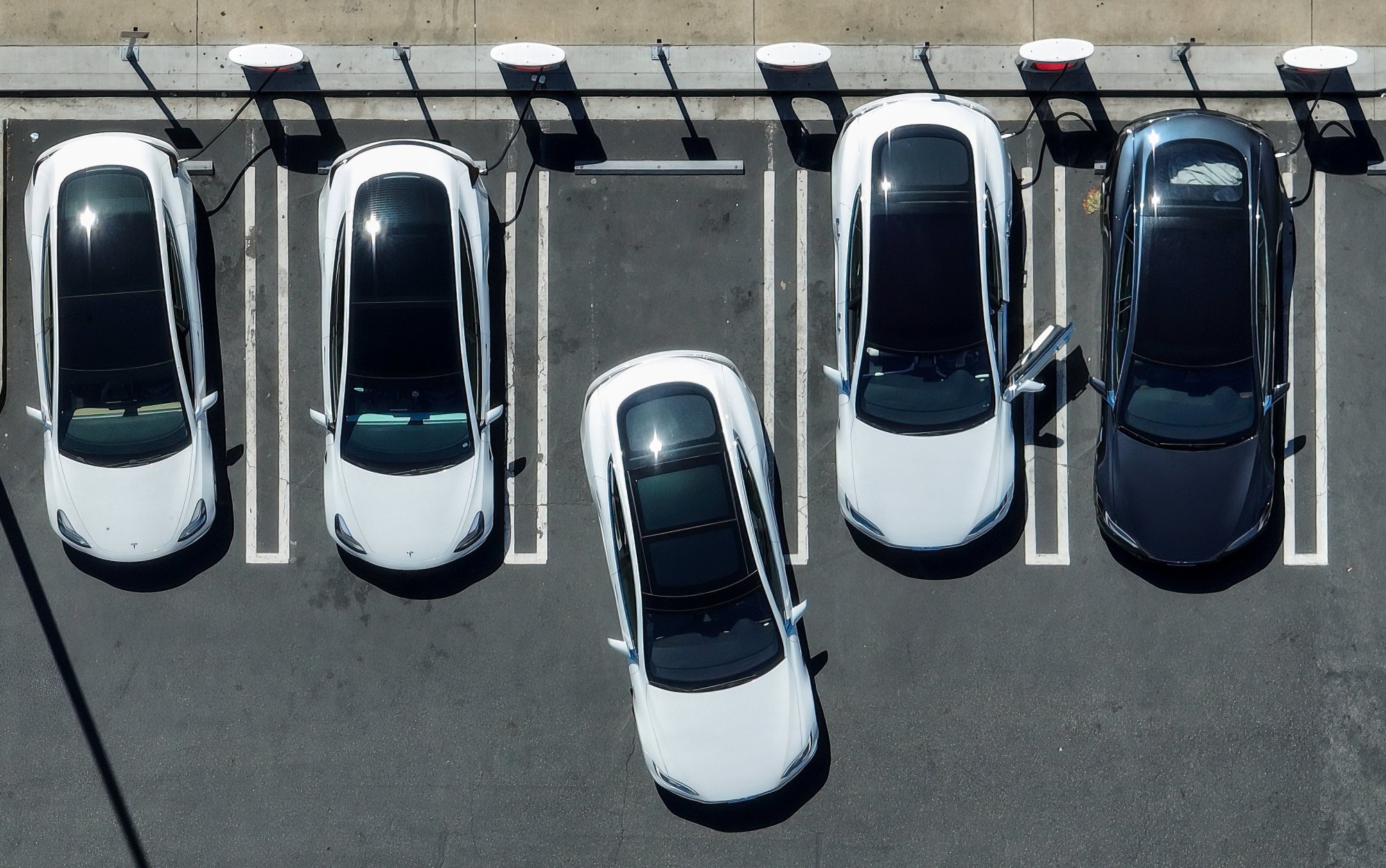 Electric car drivers charge up their vehicles at a Tesla Supercharger in Fountain Valley, CA, on Thursday, March 24, 2022. (Photo by Jeff Gritchen, Orange County Register/SCNG)