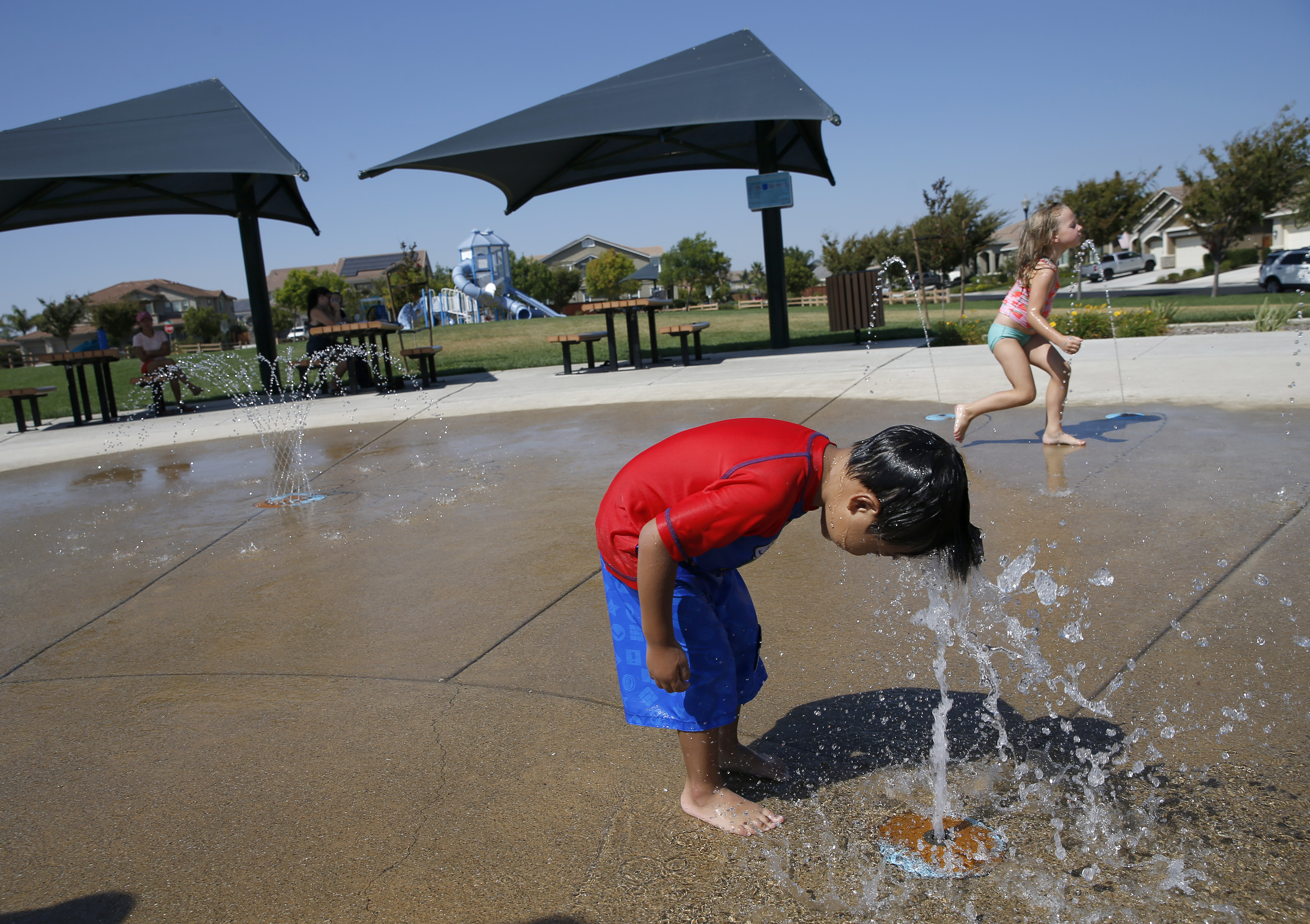 Gabriel Hutalla, 3, of Oakley, cools off at Dolphin Park in Brentwood, Calif., on Tuesday, August 16, 2022. Temperatures were near 105 degrees Tuesday afternoon. (Jane Tyska/Bay Area News Group)