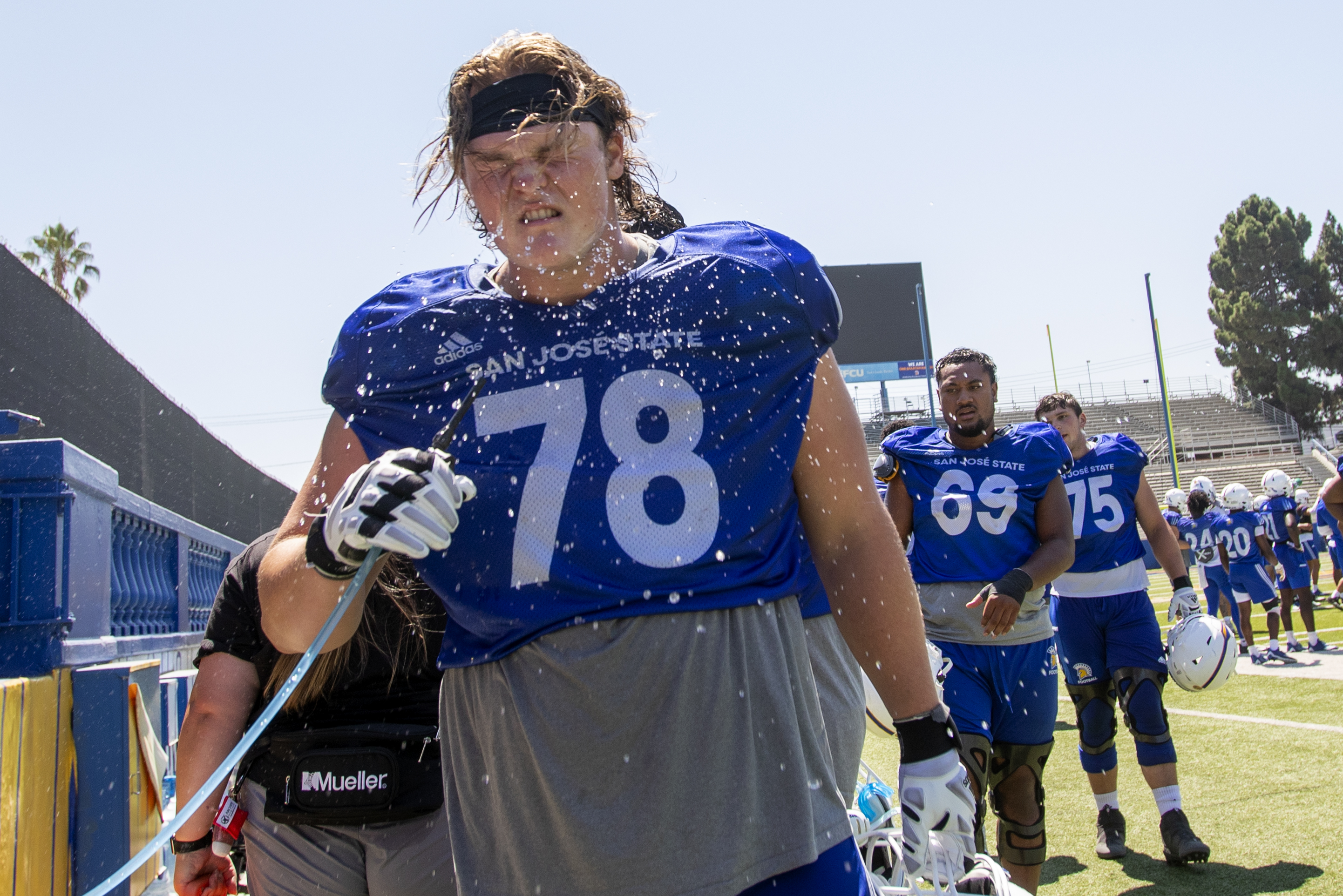 San Jose State football player Jake Steele hydrates during a hot practice, Tuesday, Aug. 16, 2022, in San Jose, Calif. (Karl Mondon/Bay Area News Group)