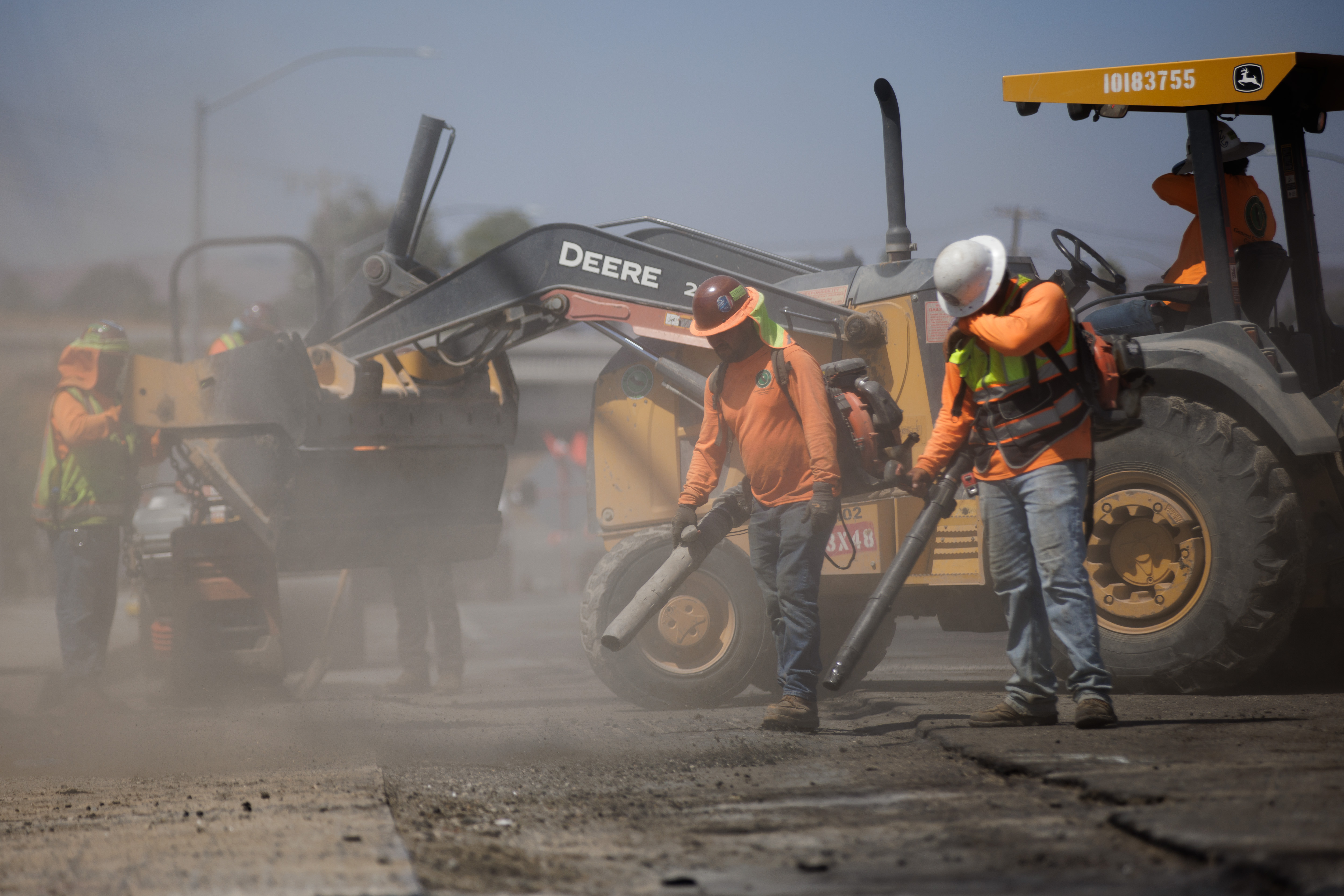 With temperatures over 100 degrees, construction workers from Eleven Western Builders work paving a road in Livermore, Calif., on Aug. 16, 2022. The road work is part of a new Chick-fil-A restaurant location. (Dai Sugano/Bay Area News Group)