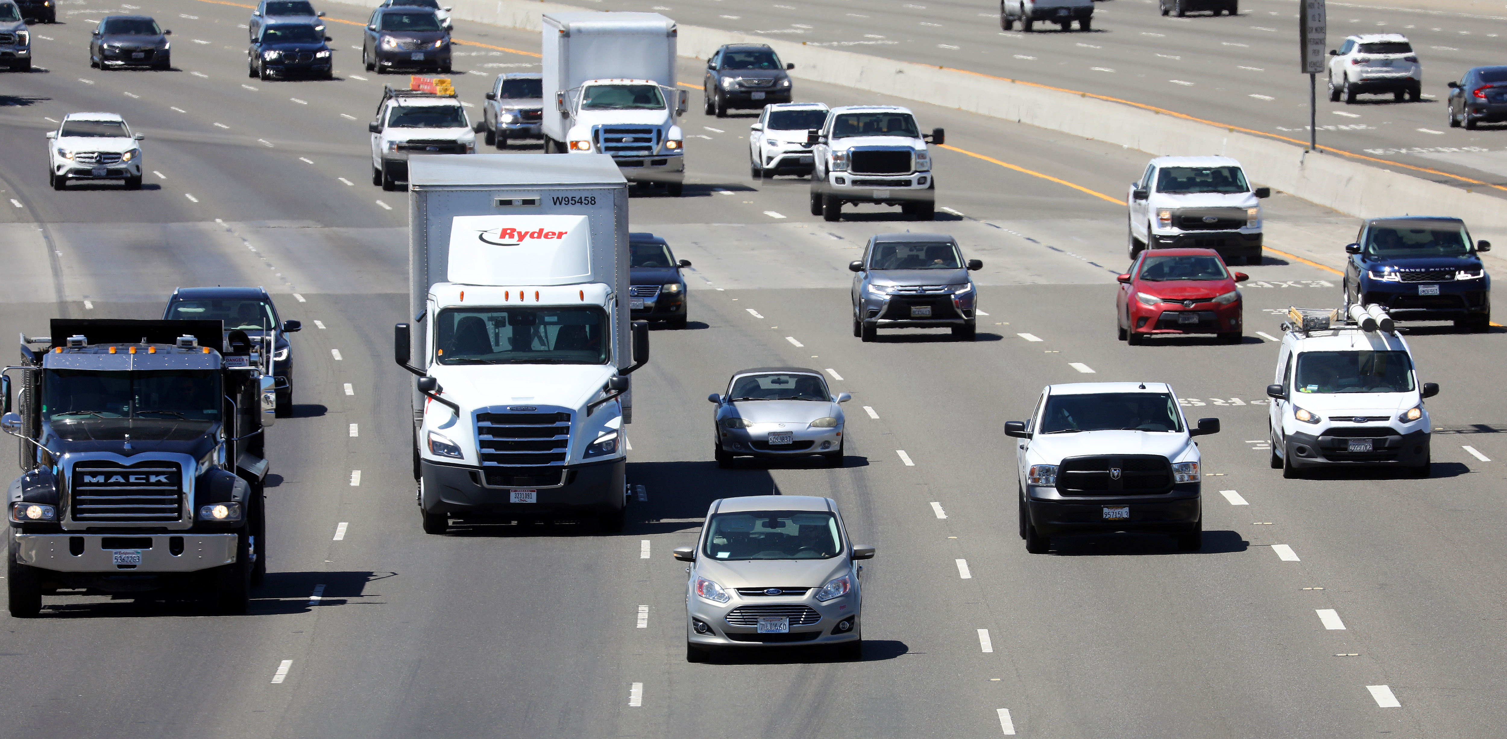 Vehicles move along eastbound interstate 580 on Wednesday, Aug. 24, 2022, in Livermore, Calif. California air regulators are scheduled to vote Thursday on landmark new rules to prohibit the sale of all new gasoline-powered cars, SUVs, minivans, and pickups in the state by 2035. (Aric Crabb/Bay Area News Group)