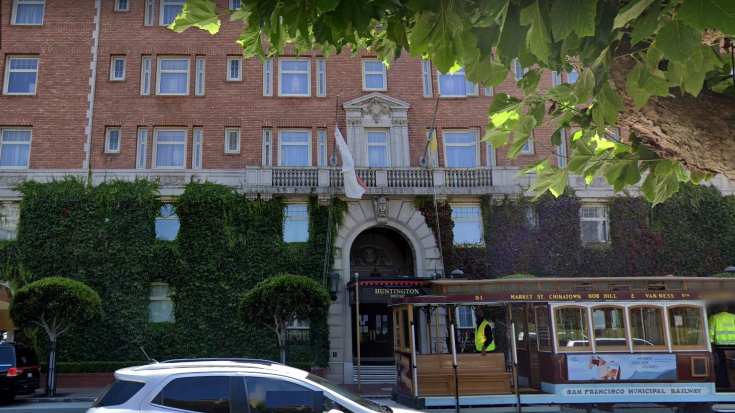 Cable car passes the Huntington Hotel, a luxury historic hotel at 1075 California St. atop Nob Hill in San Francisco. (Google Maps)