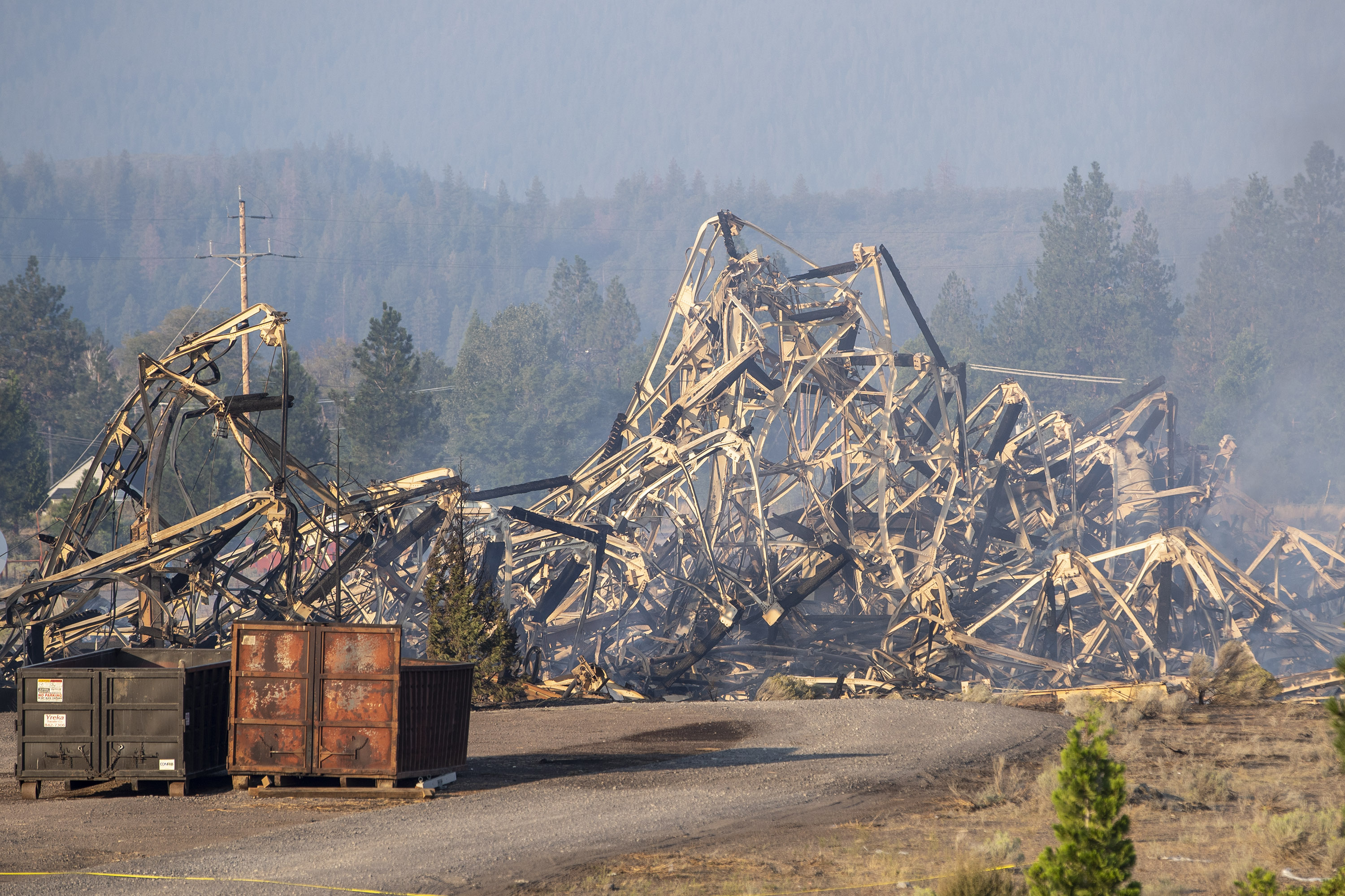 WEED, CALIFORNIA - SEPTEMBER 3: A tangled pile of twisted metal is all that remains on Saturday morning, Sep. 3, 2022, of a Roseburg Forest Products building destroyed in yesterday's Mill Fire in Weed, Calif. (Karl Mondon/Bay Area News Group)