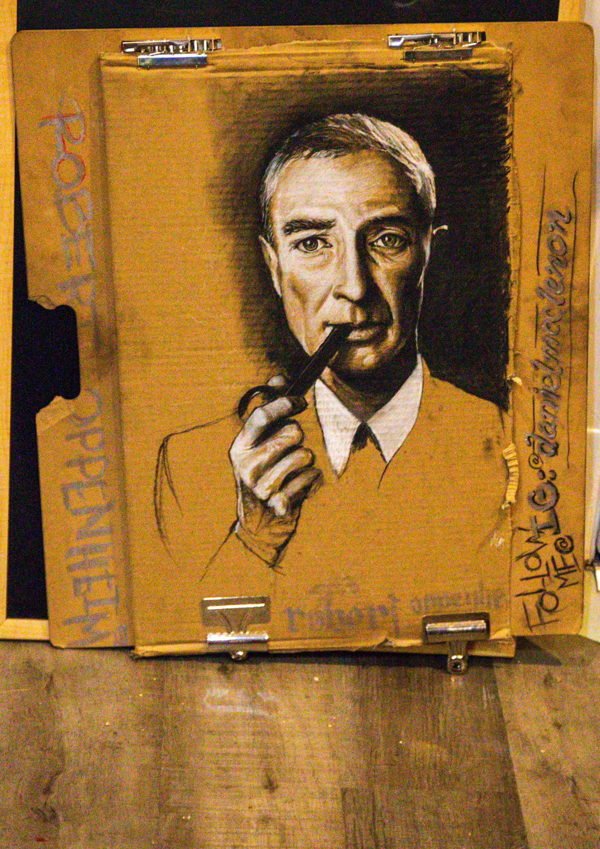 SAN FRANCISCO, CALIFORNIA - OCTOBER 6: Artist Daniel McClenon, who was homeless, shows his latest work in process, a charcoal portrait on a cardboard of Robert Oppenheimer, known as the father of the atomic bomb, at his temporary housing in San Francisco, Calif., on Thursday, Oct. 6, 2022. (Ray Chavez/Bay Area News Group)