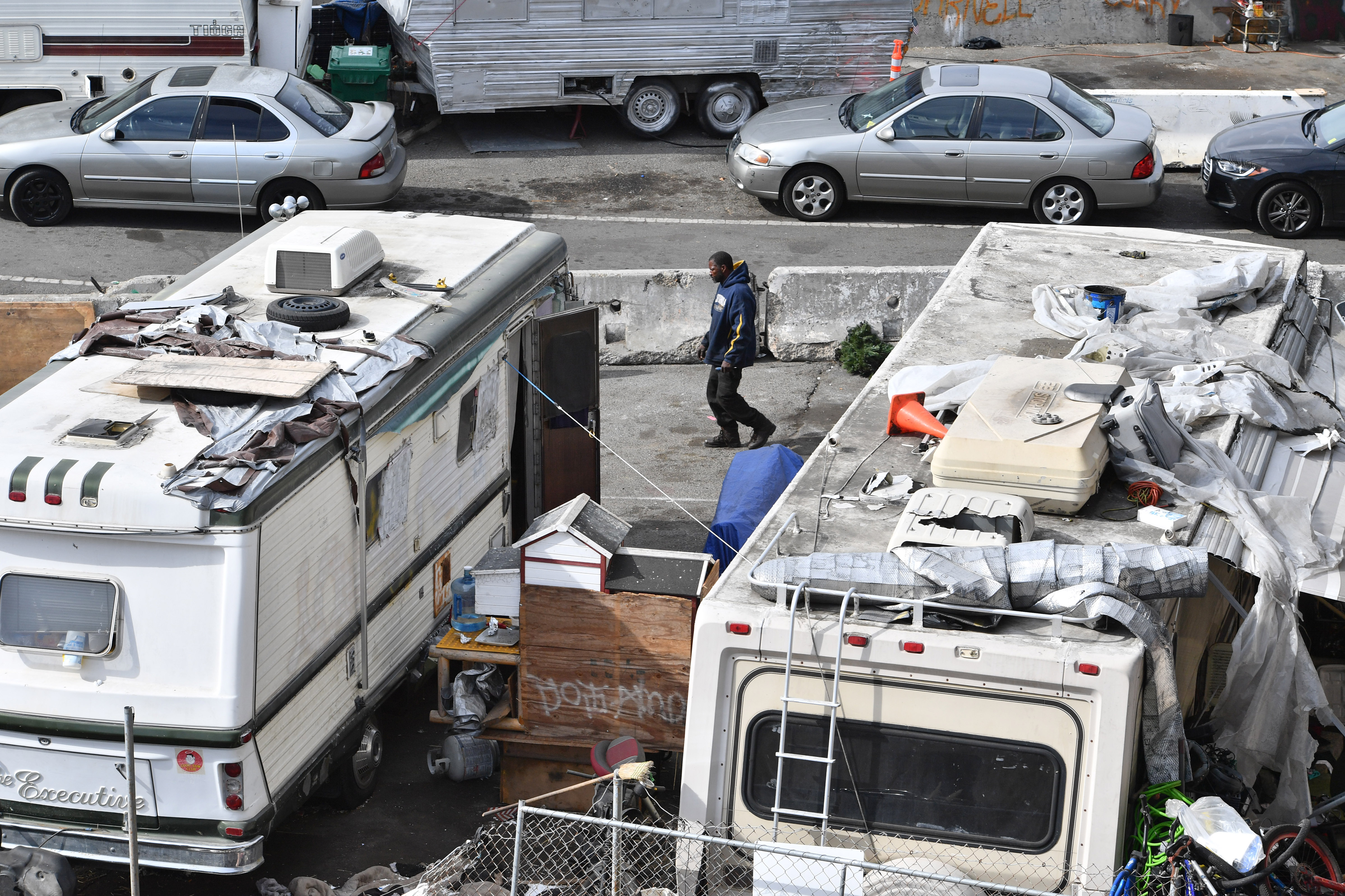 A man walks through a homeless encampment near Castro Street in Richmond, Calif., on Friday, Oct. 28, 2022. The city of Richmond received $4.8 million in February to clear the encampment. (Jose Carlos Fajardo/Bay Area News Group)