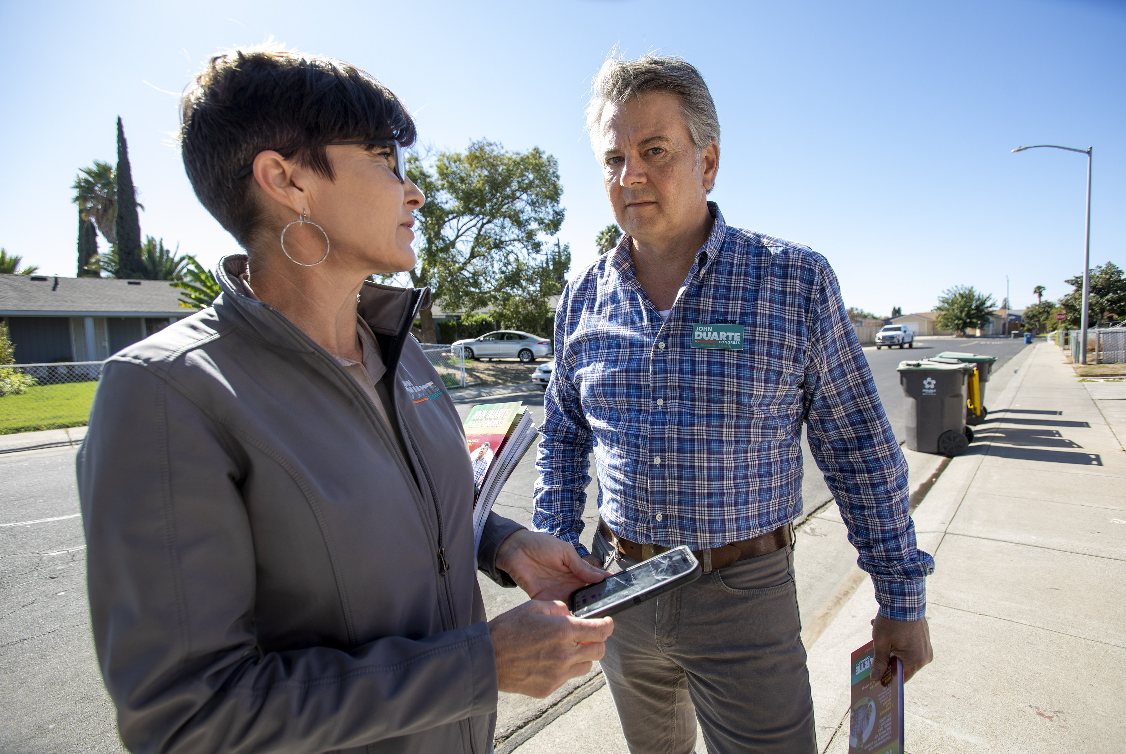 Republican farmer John Duarte and his wife Alexandra campaign in a neighborhood in Lathrop, Calif.