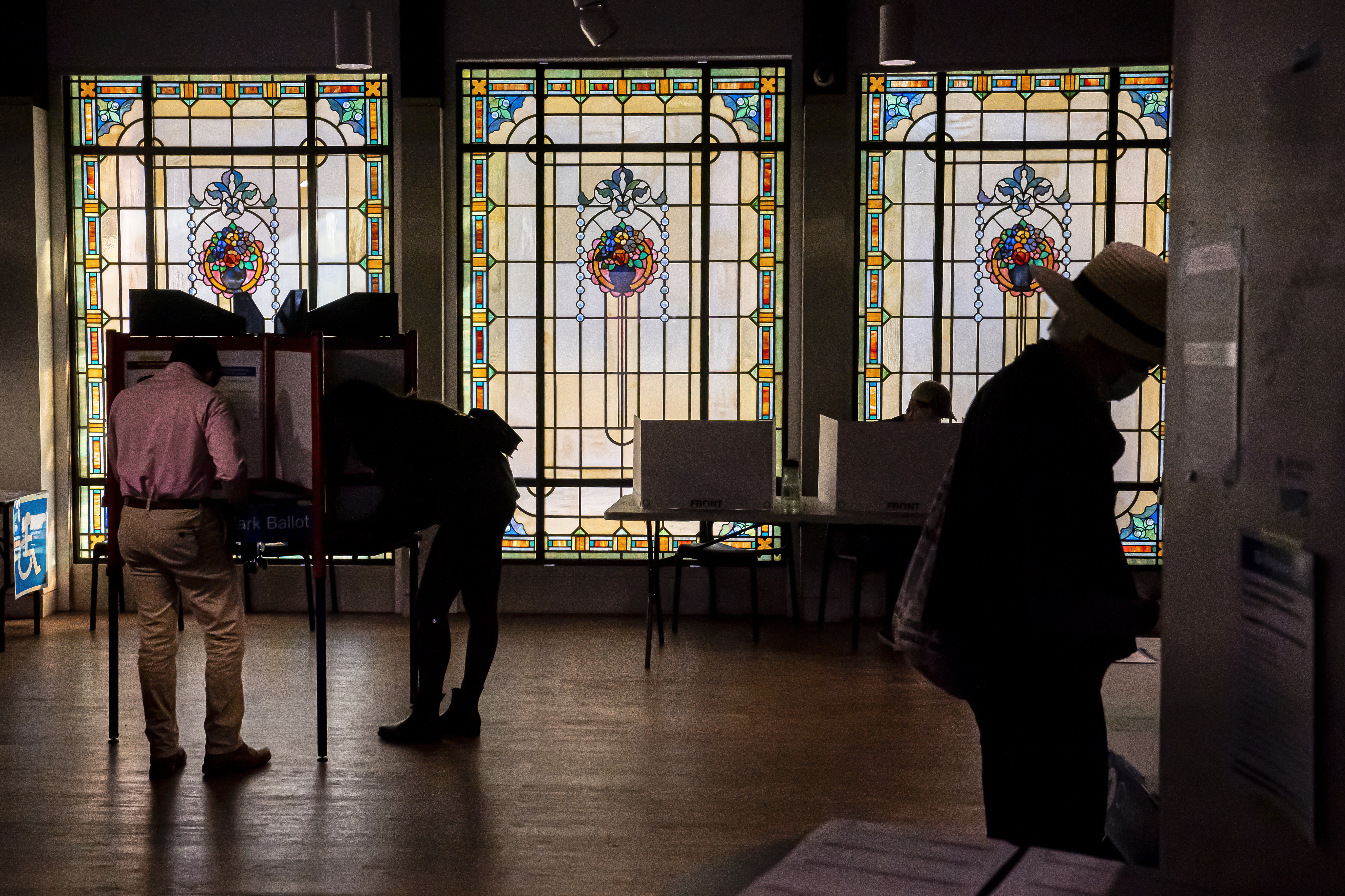 Voters cast their ballots at a polling location inside the Museum of Contemporary Art on November 8, 2022 in Arlington,Virginia. (Photo by Nathan Howard/Getty Images)
