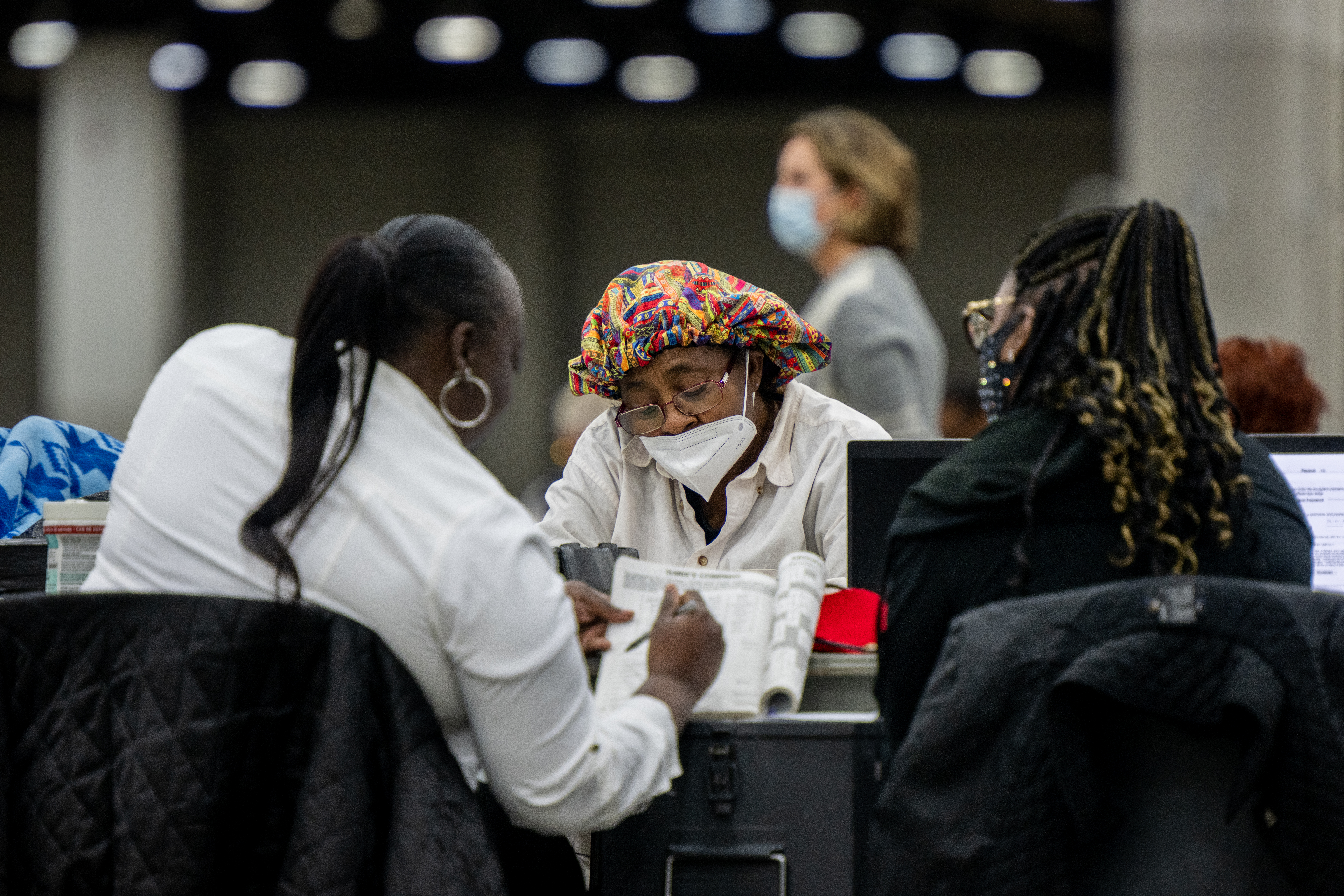 Election inspectors work during a shift at the Huntington Place convention center on November 08, 2022 in Detroit, Michigan. (Photo by Brandon Bell/Getty Images)
