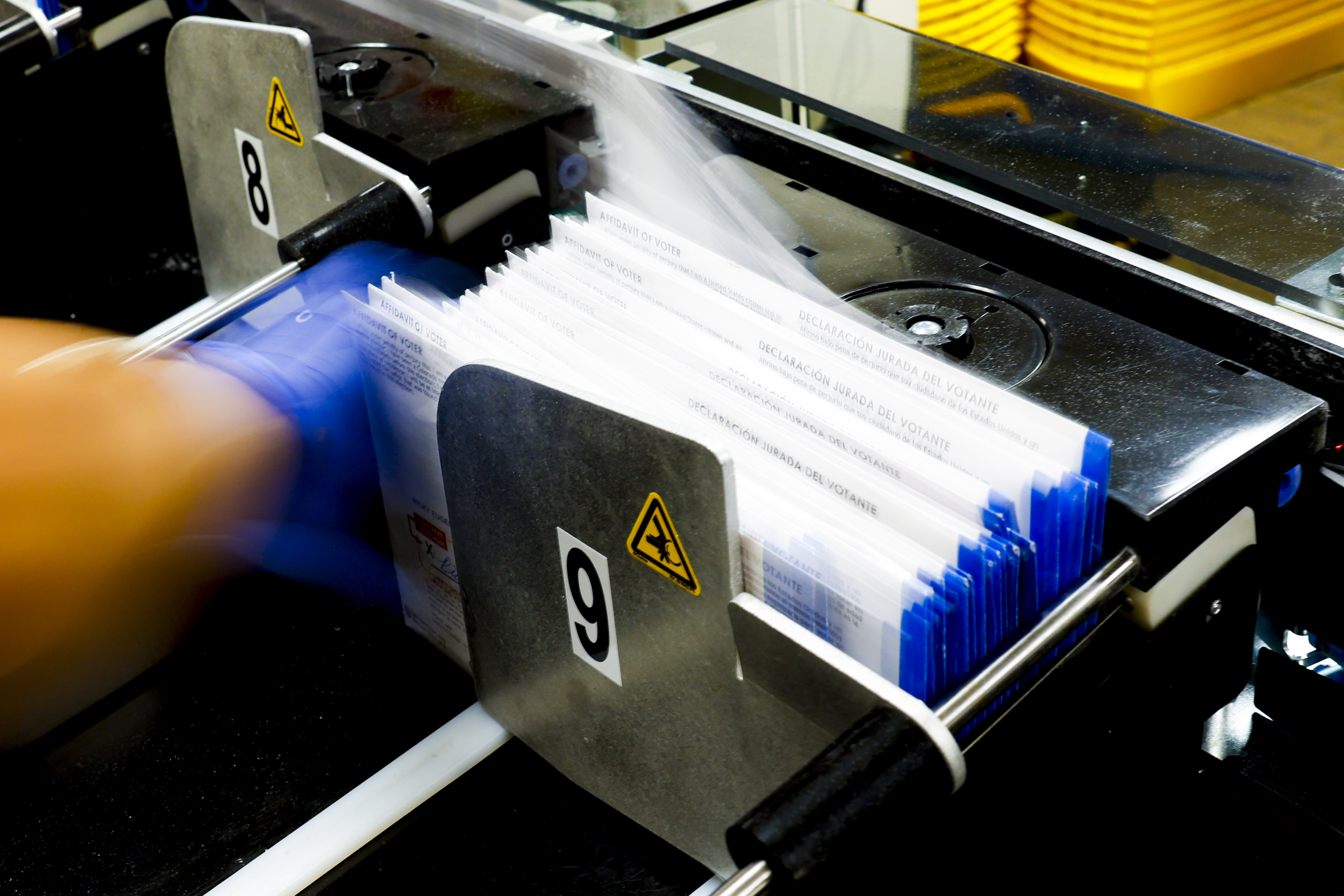 Denver election judge Danielle Puscatelli runs the ballot sorting system at the Denver Elections Division on November 8, 2022 in Denver, Colorado. (Photo by Michael Ciaglo/Getty Images)