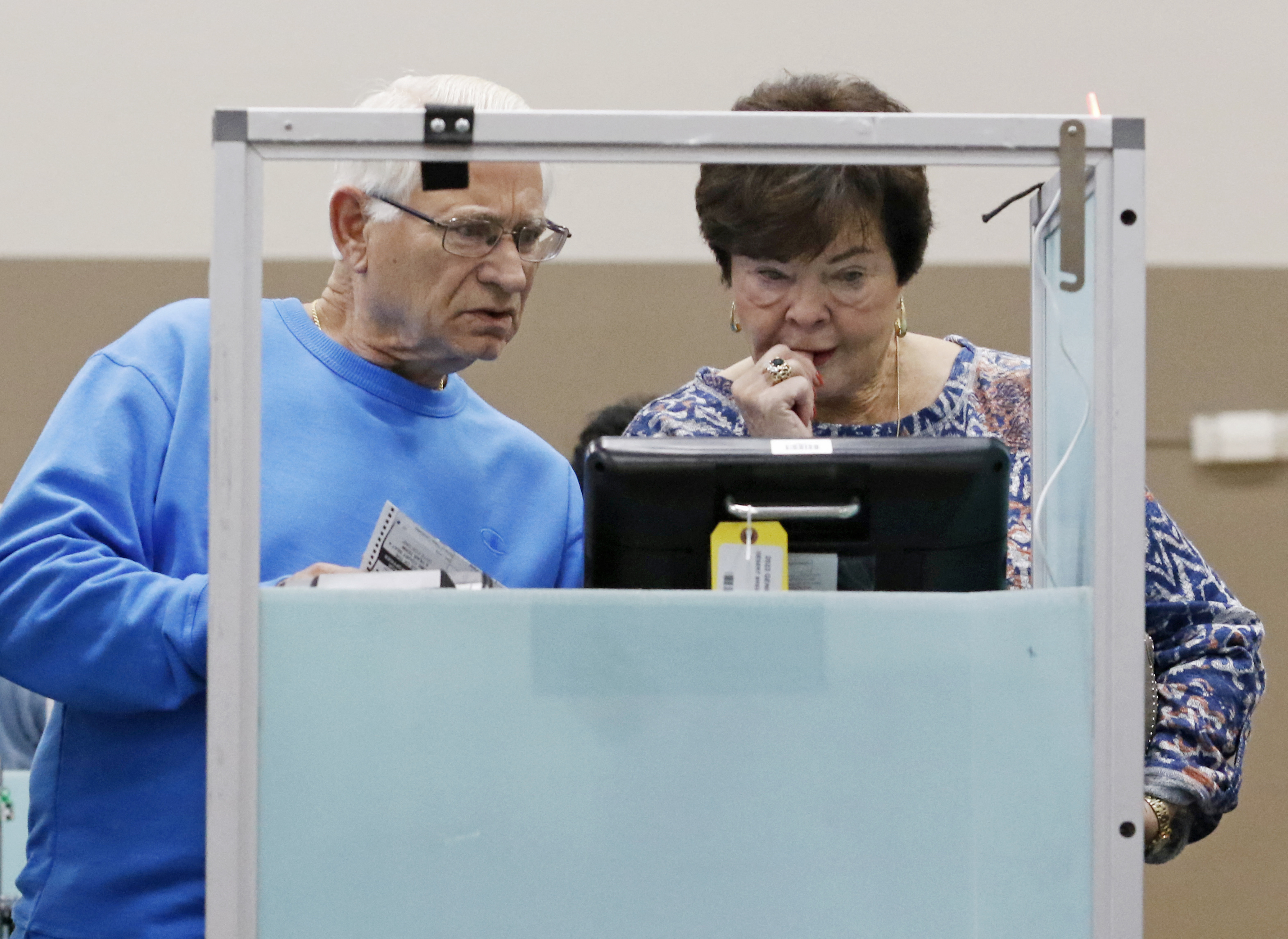 Marshall Bishop, left, and partner Doris Burnett, both of Las Vegas, vote at Desert Breeze Community Center on Election Day in Las Vegas, Nevada on November 8, 2022. (Photo by Ronda Churchill/AFP via Getty Images)