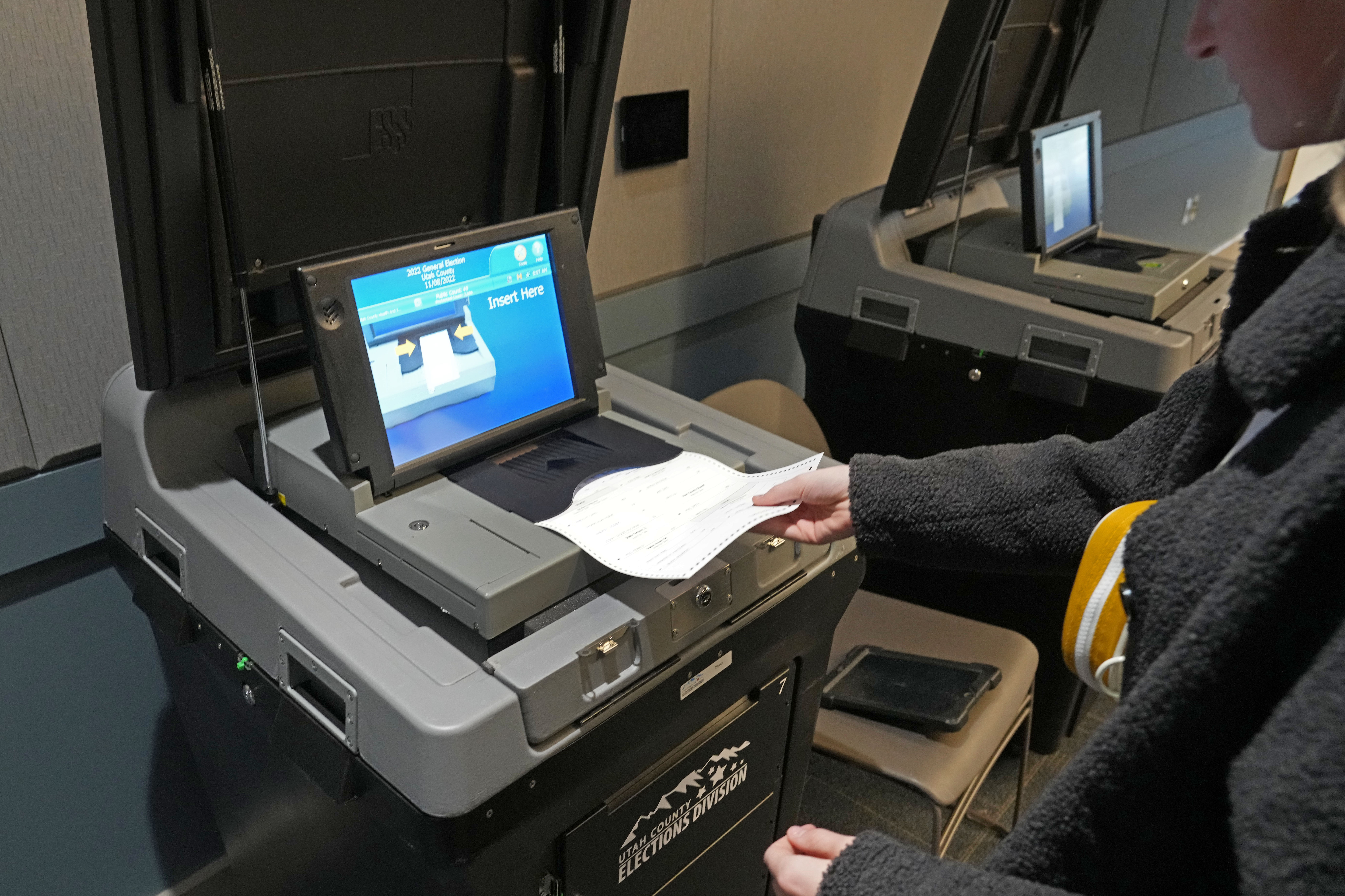 A voter has her ballot scanned at the Utah County Justice and Health center on November 8, 2022 in Provo, Utah. (Photo by George Frey/Getty Images)