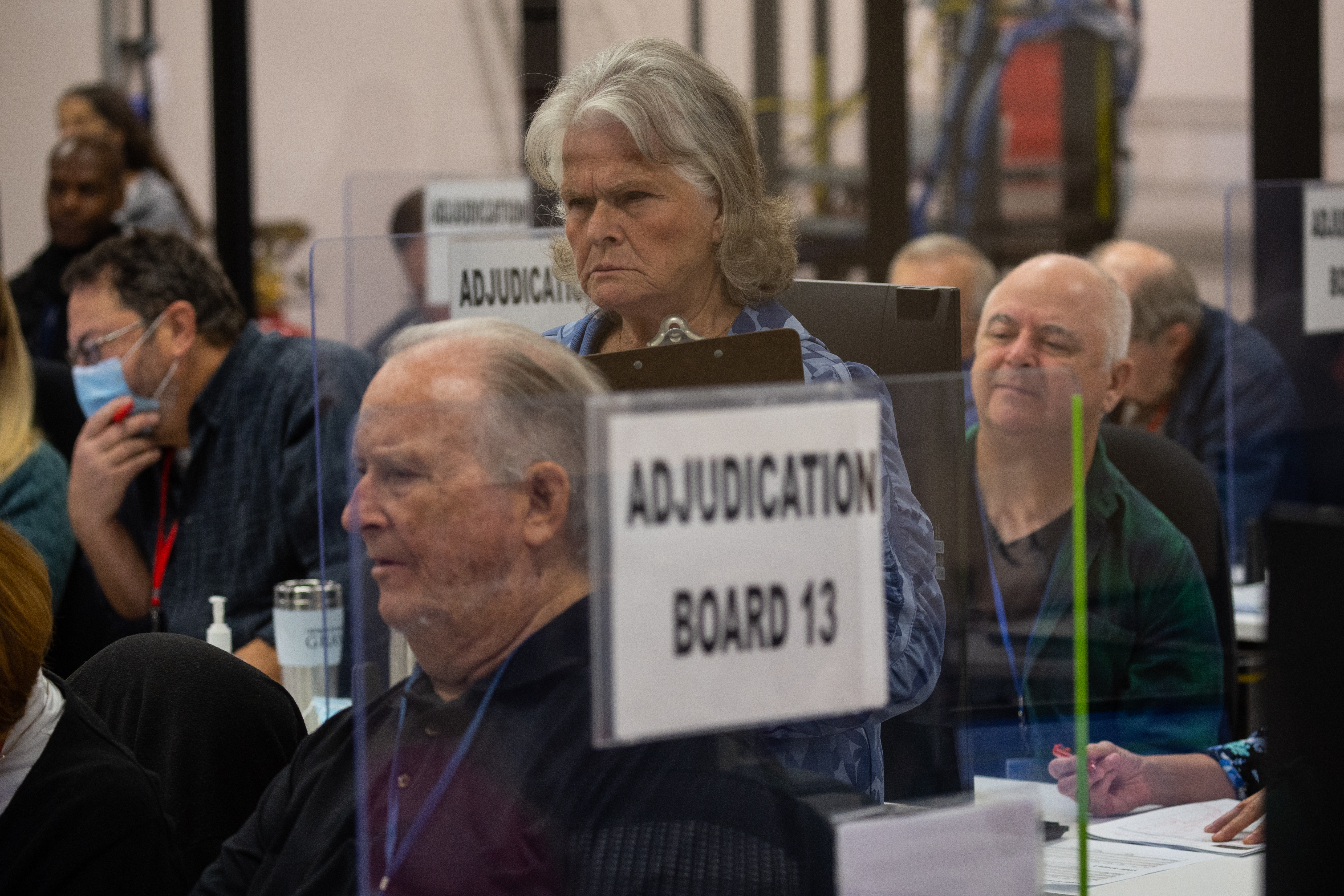 An adjudication board reviews ballots at the Maricopa County Tabulation and Election Center on November 08, 2022 in Phoenix, Arizona. (Photo by John Moore/Getty Images)
